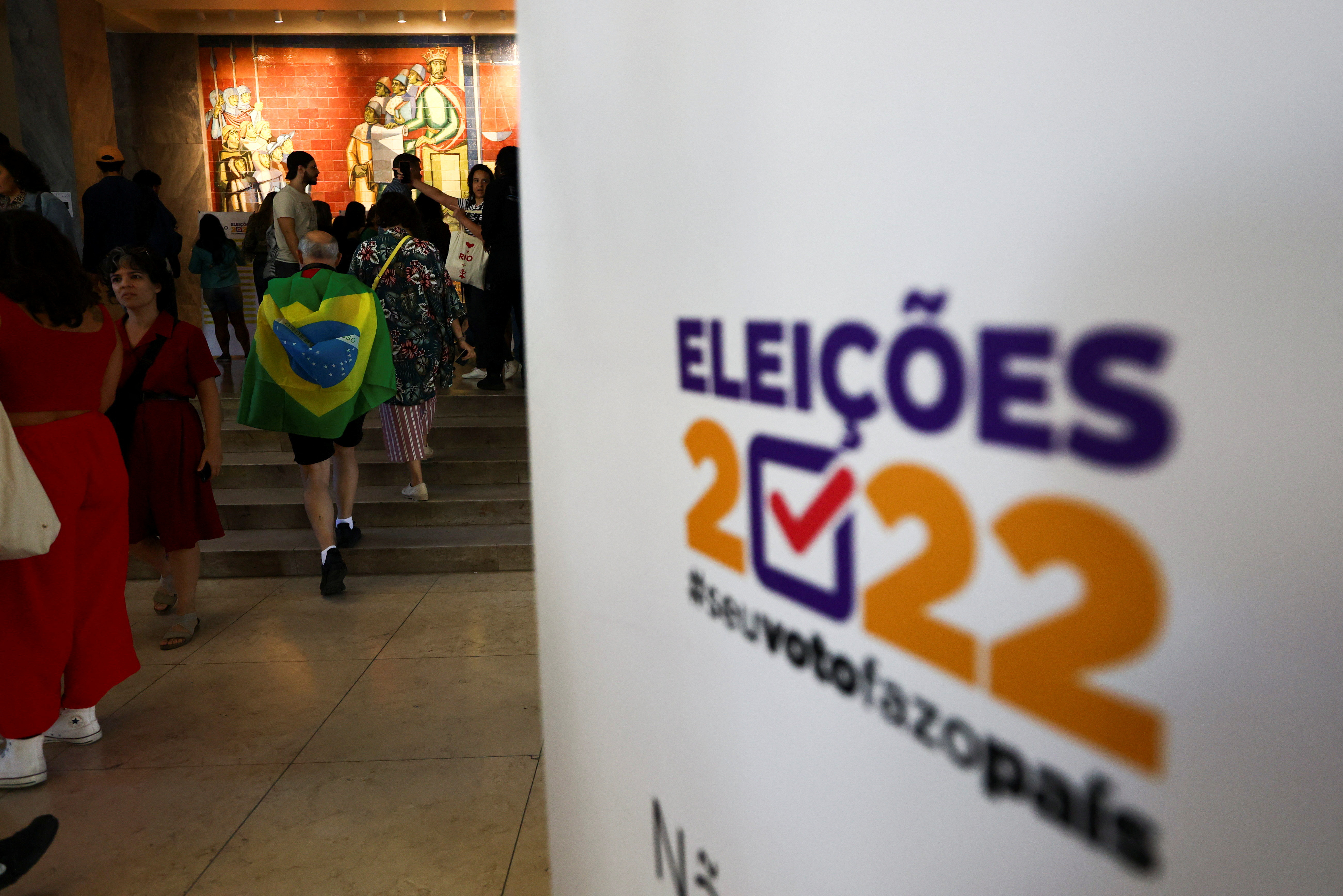 Citizens of Brazil wait in line to cast their votes in their country's elections in Lisbon, Portugal October 2, 2022.  REUTERS/Pedro Nunes