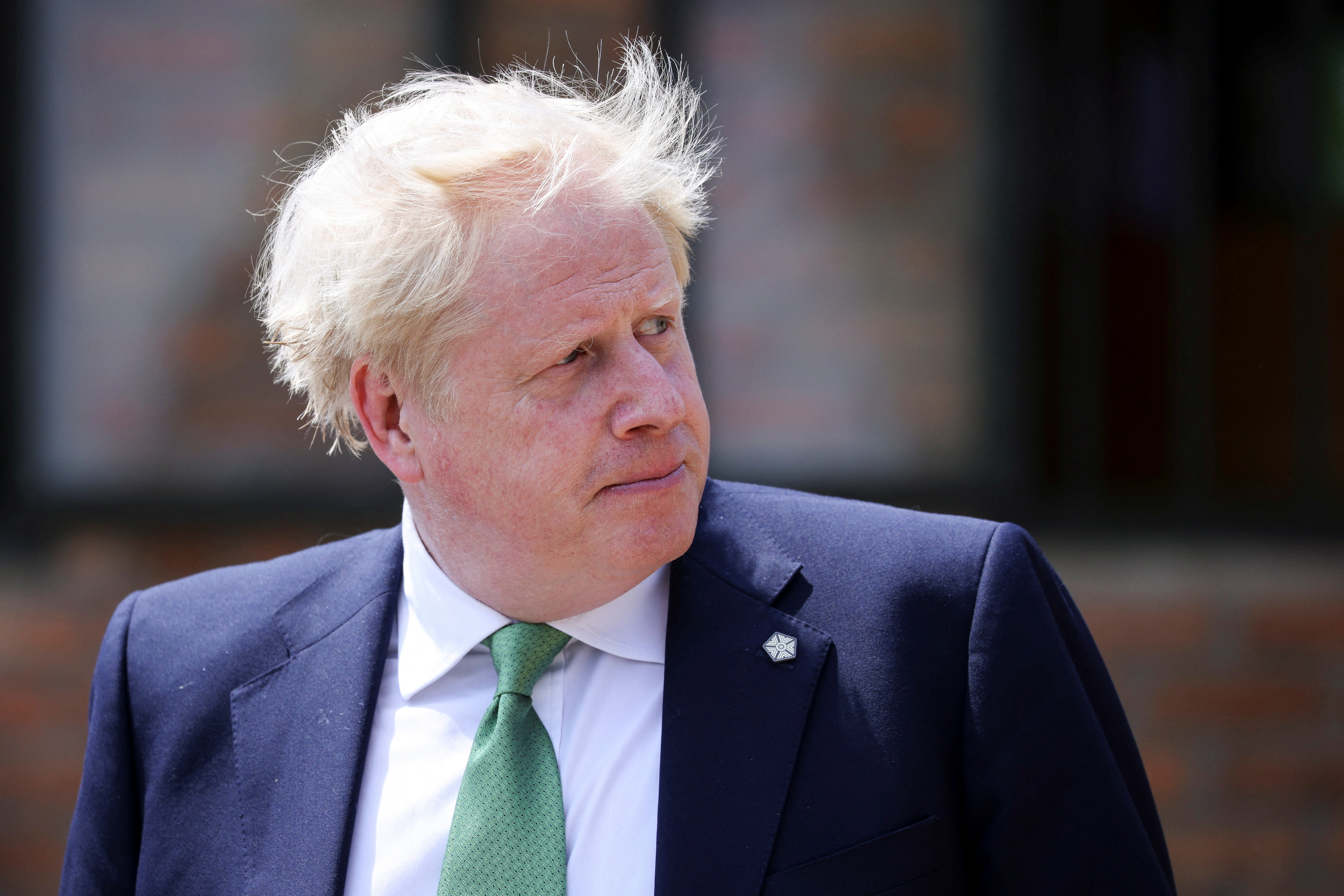 British Prime Minister Boris Johnson looks on during a visit to the GS Kacyiru II school on the sidelines of the Commonwealth Heads of Government Meeting (CHOGM) in Kigali, Rwanda June 23, 2022. Dan Kitwood/Pool via REUTERS