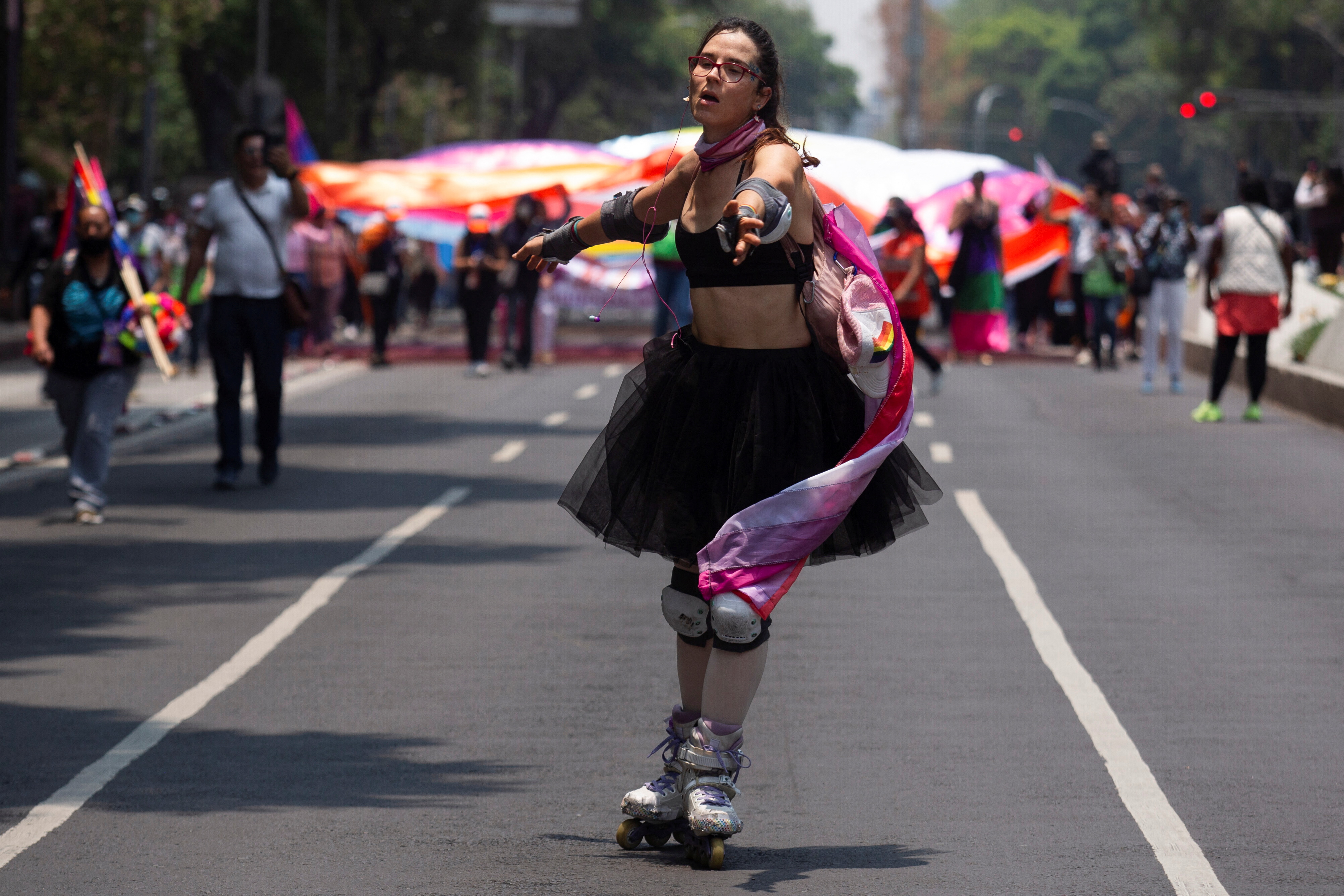 A demonstrator in roller skates takes part in an LGBT protest named "Marcha Lencha 2022" against gender violence and to demand respect for their human rights, in Mexico City, Mexico June 18, 2022. REUTERS/Quetzalli Nicte-Ha