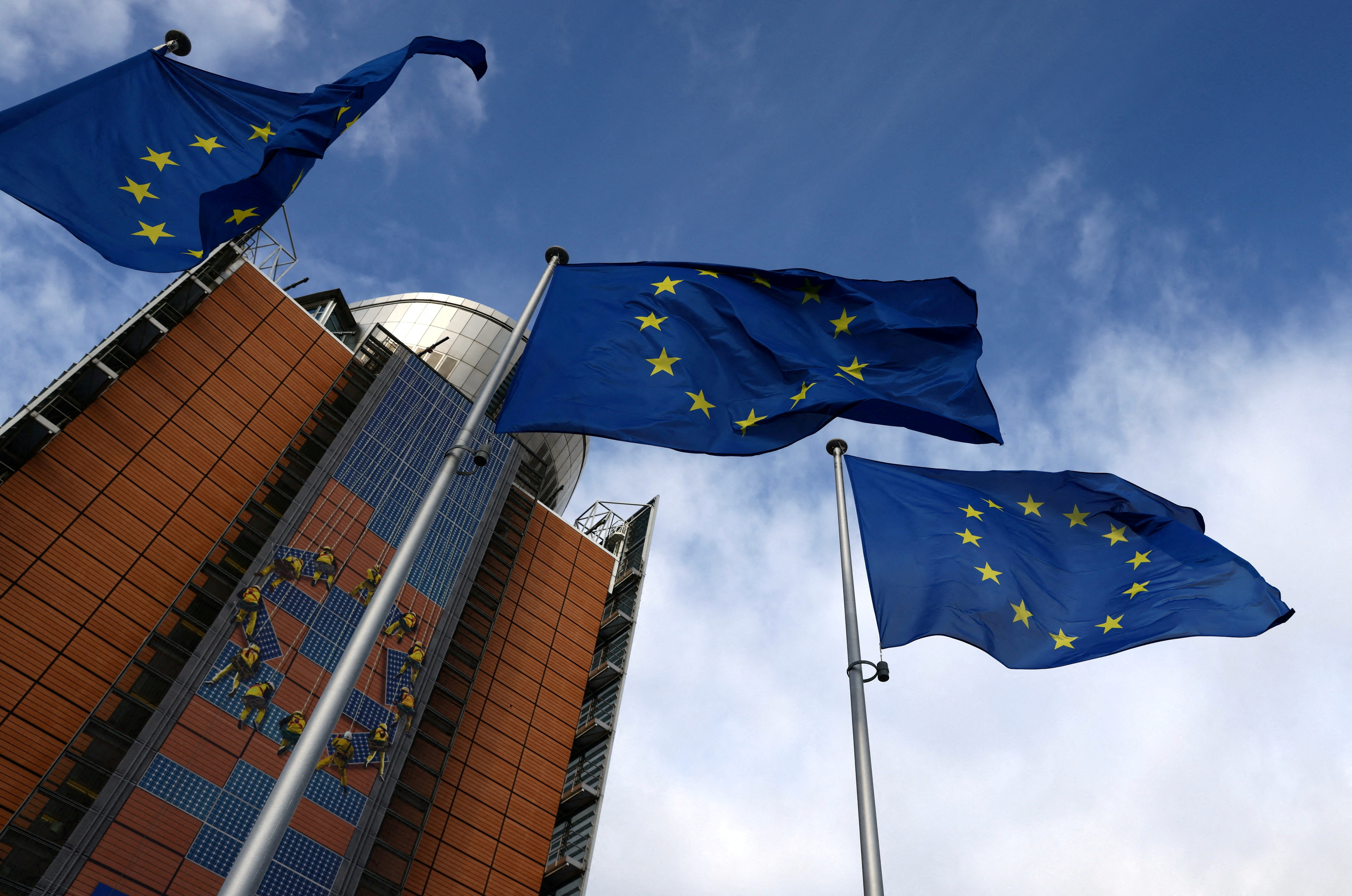 European Union flags fly in front of the EU Commission headquarters, in Brussels, Belgium, February 1, 2023 (REUTERS/Yves Herman/file)