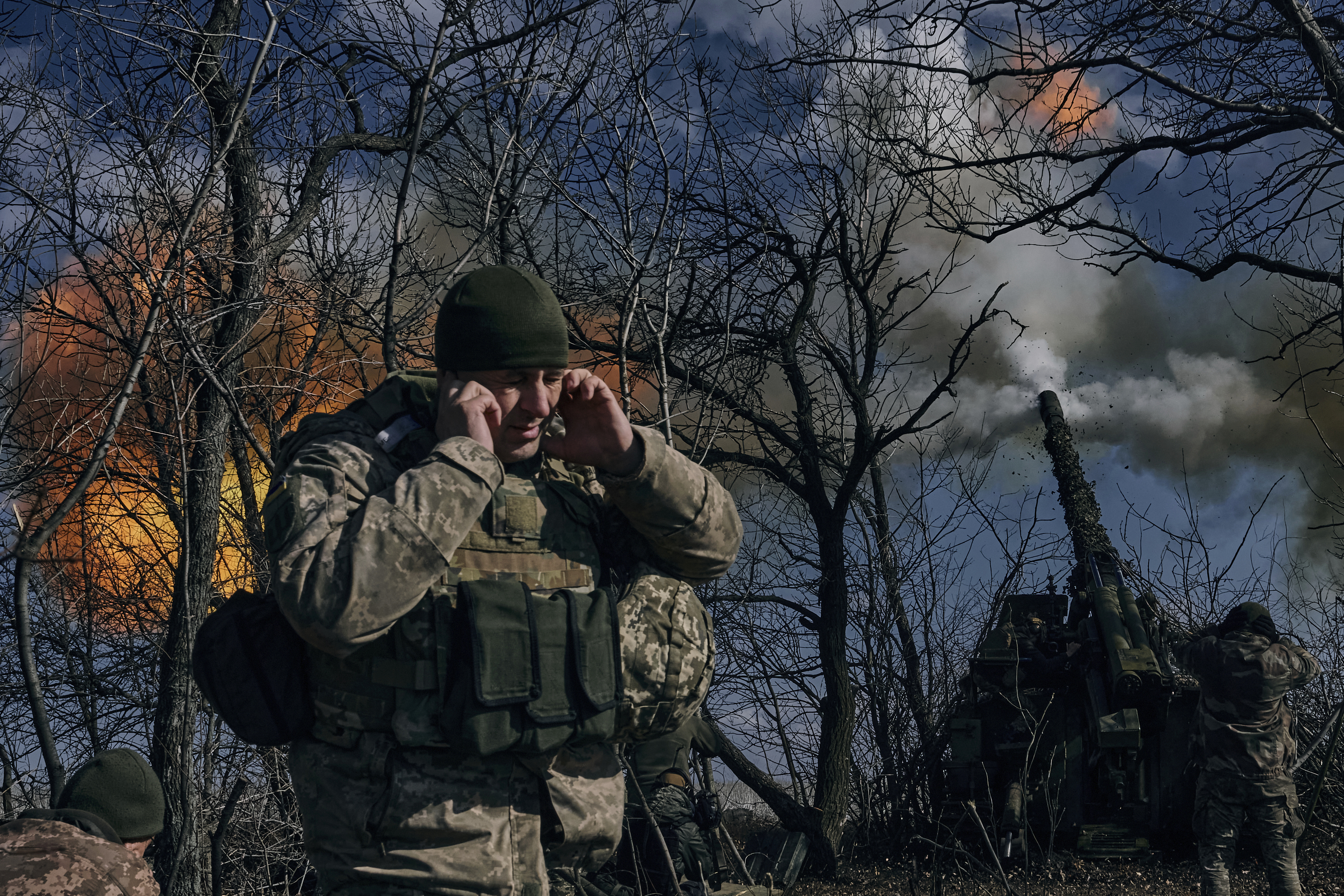 Ukrainian soldiers fire a shell at Russian positions near Bakhmut, in the Donetsk region, Ukraine, Sunday, March 5, 2023. (AP Photo/Libkos)