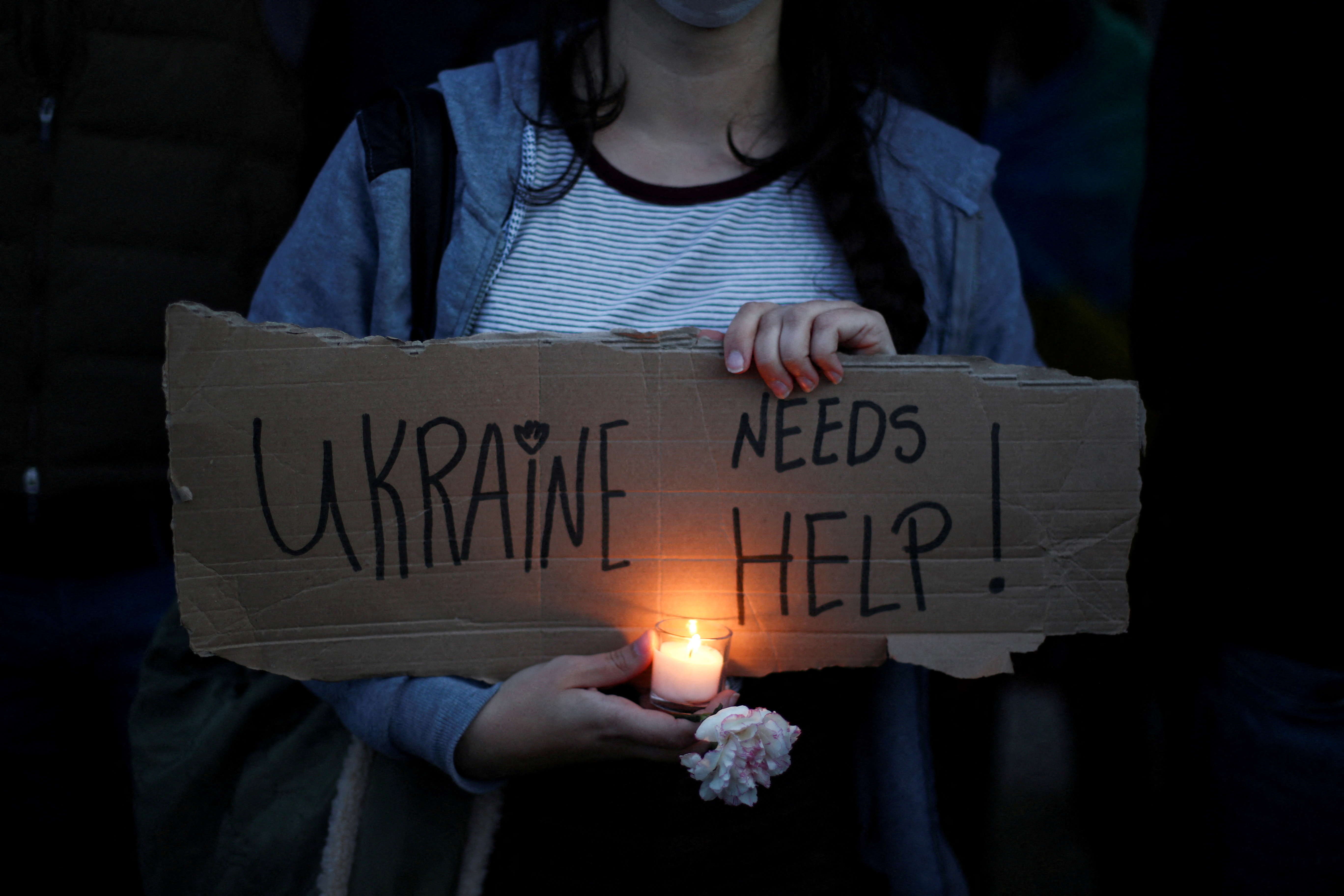FILE PHOTO: People take part in an anti-war protest, after Russia launched a massive military operation against Ukraine, in Lisbon, Portugal, February 27, 2022. REUTERS/Pedro Nunes/File Photo