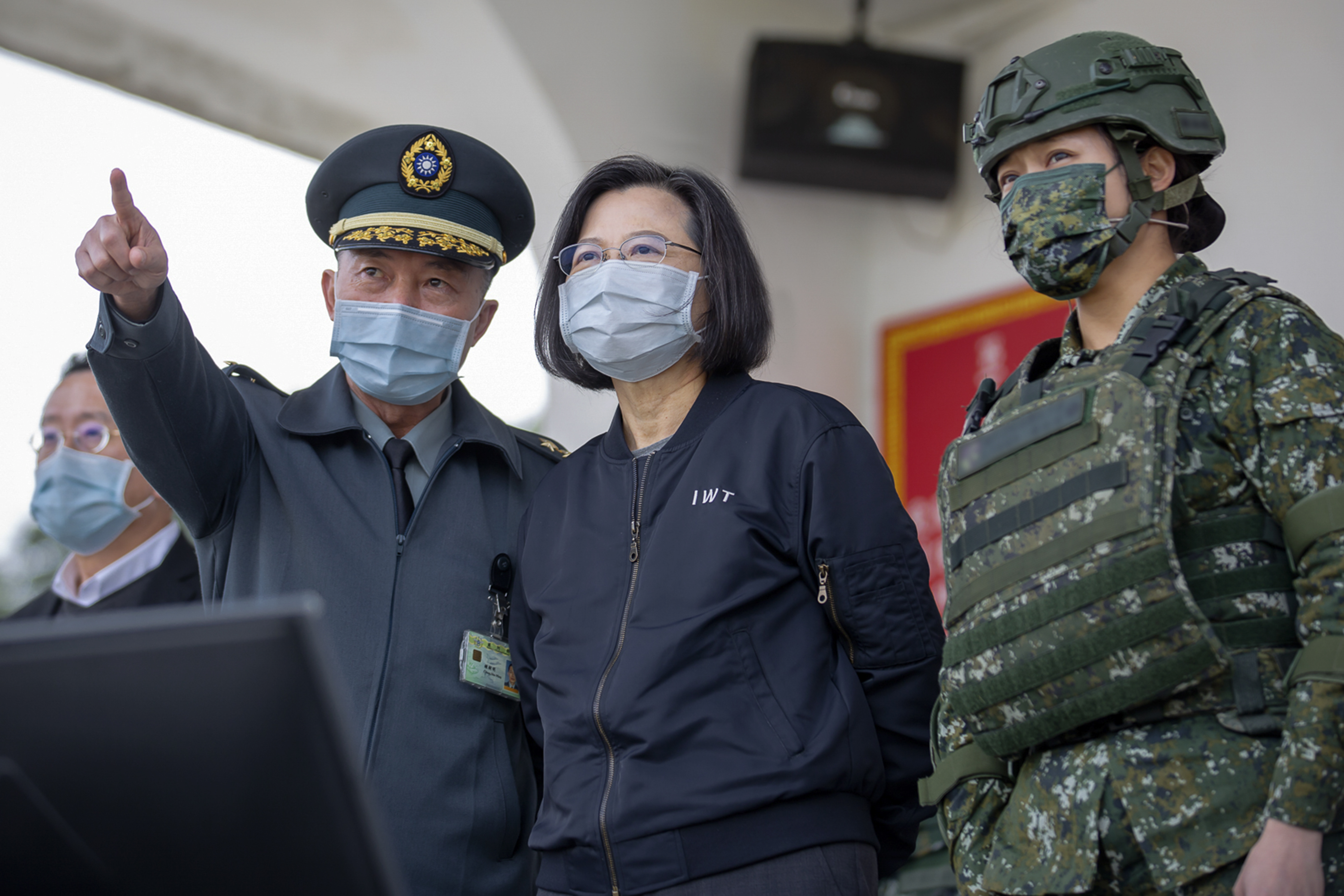 This handout photo released by the Taiwan Presidency shows Taiwan President Tsai Ing-wen, accompanied by military commanders, as she witnesses war drills at a military base in Chiayi, Taiwan, Friday, Jan. 6, 2023. ( Taiwan Presidency via AP)