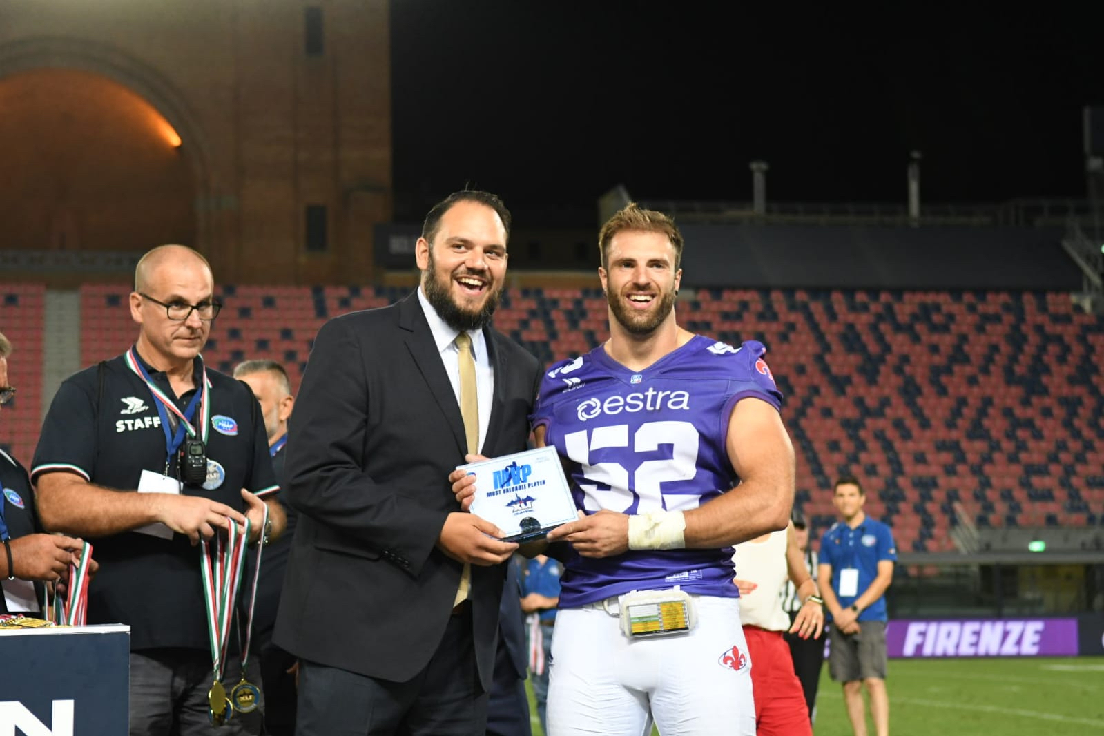  Pierre Trochet, President of IFAF, presents Guelfi Firenze’s defensive end Lorenzo Dalle Piagge with the MVP award in Bologna. Photo credit/ @Manuela Pellegrini. 