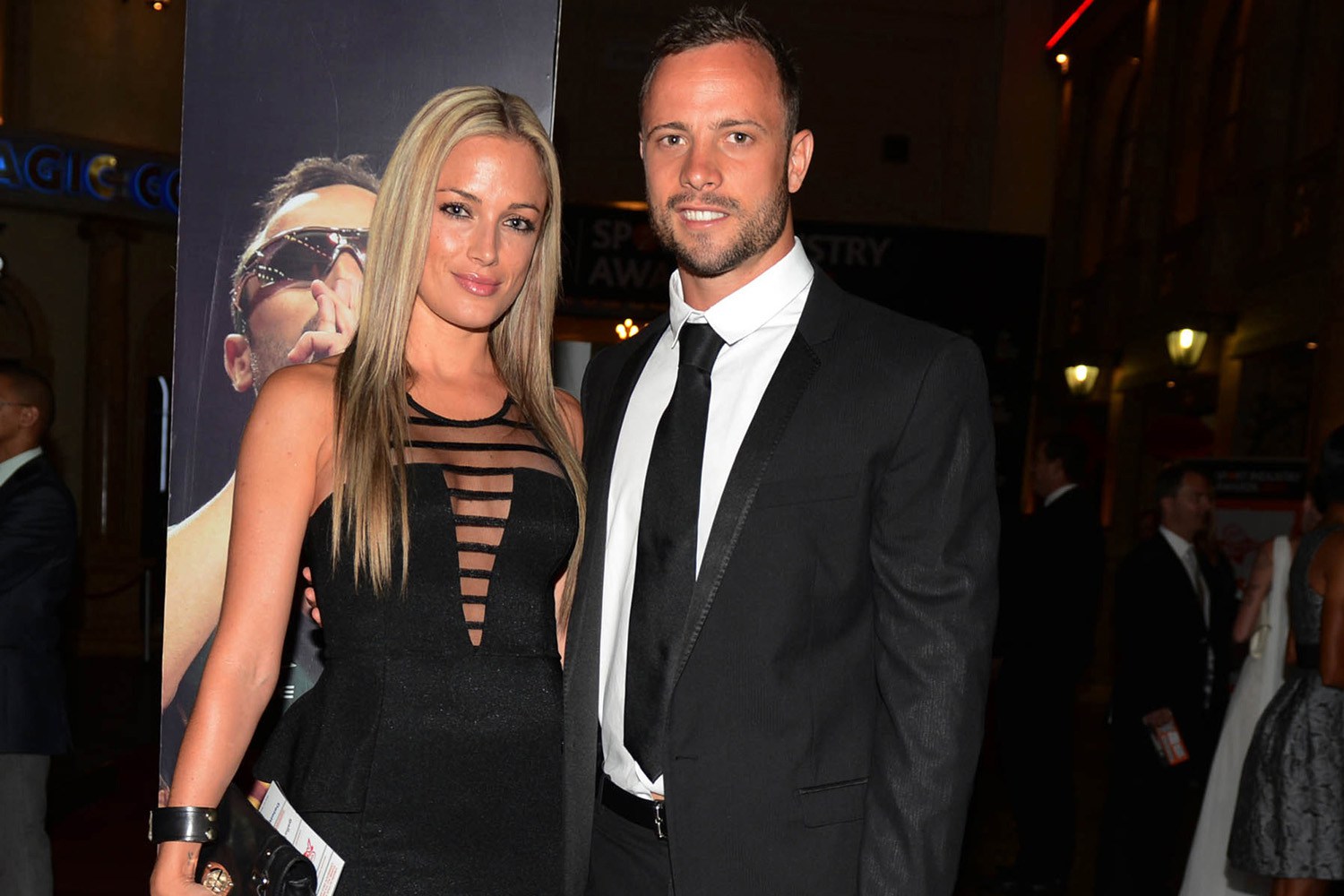 Oscar Pistorius (R) and his girlfriend Reeva Steenkamp pose for a picture in Johannesburg, February 7, 2013. South African "Blade Runner" Oscar Pistorius, a double amputee who became one of the biggest names in world athletics, was charged on February 14, with shooting dead his girlfriend at his home in Pretoria. Picture taken February 7, 2013. REUTERS/Thembani Makhubele (SOUTH AFRICA - Tags: CRIME LAW SPORT ATHLETICS TPX IMAGES OF THE DAY) - RTR3DS4U