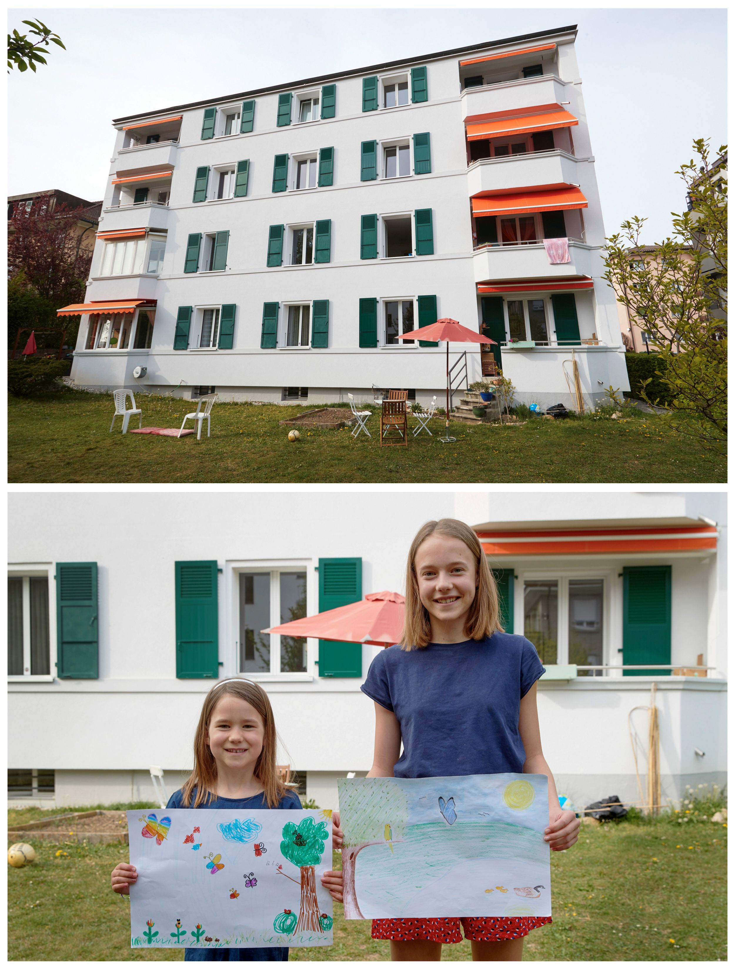 Eva y Camilla Auer, posando para una foto mientras sostienen dibujos que hicieron durante el brote de coronavirus, en su casa en Lausana, Suiza, el 17 de abril de 2020.