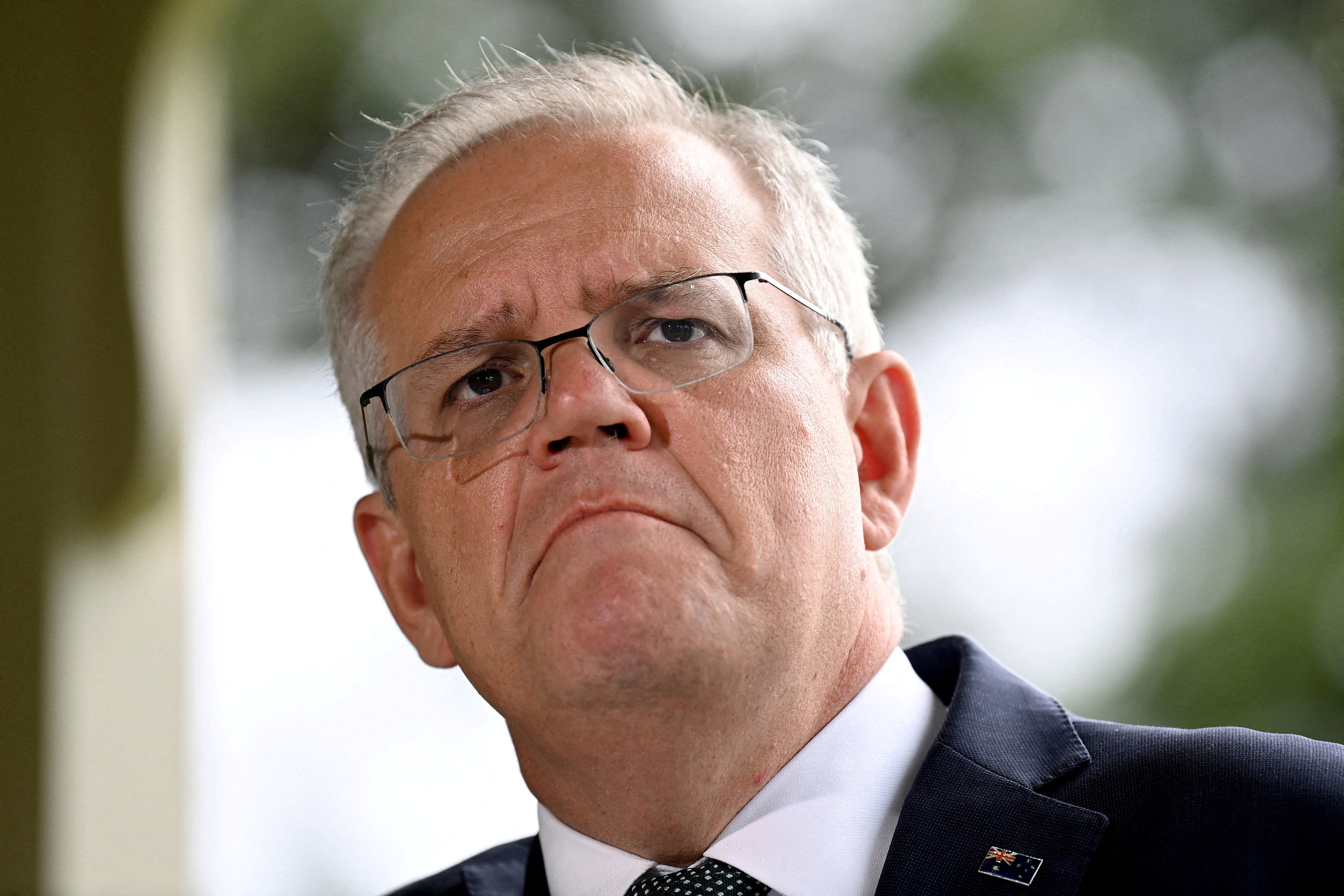 FILE PHOTO: Australia's Prime Minister Scott Morrison reacts as he speaks to the media during a press conference at Kirribilli House in Sydney, Australia, February 24, 2022. AAP Image/Bianca De Marchi via REUTERS ATTENTION EDITORS - THIS IMAGE WAS PROVIDED BY A THIRD PARTY. NO RESALES. NO ARCHIVE. AUSTRALIA OUT. NEW ZEALAND OUT. NO COMMERCIAL OR EDITORIAL SALES IN NEW ZEALAND. NO COMMERCIAL OR EDITORIAL SALES IN AUSTRALIA./File Photo