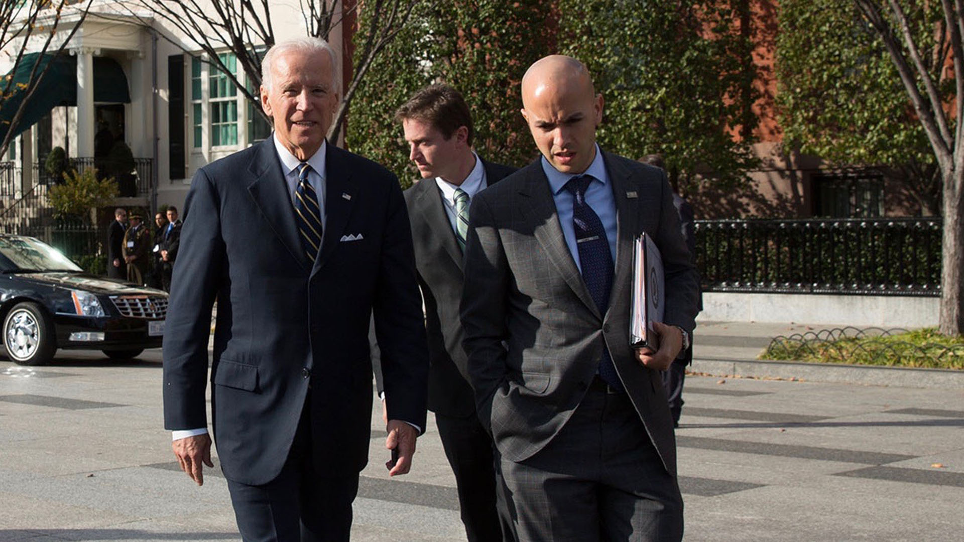 Vice President Joe Biden walks across Pennsylvania and West Executive Avenues, en route to the White House from the Blair House, in Washington, D.C., Nov. 14, 2014. Pictured are Juan Gonzalez, Billy Davis, Michael Schrum. (Official White House Photo by David Lienemann) 