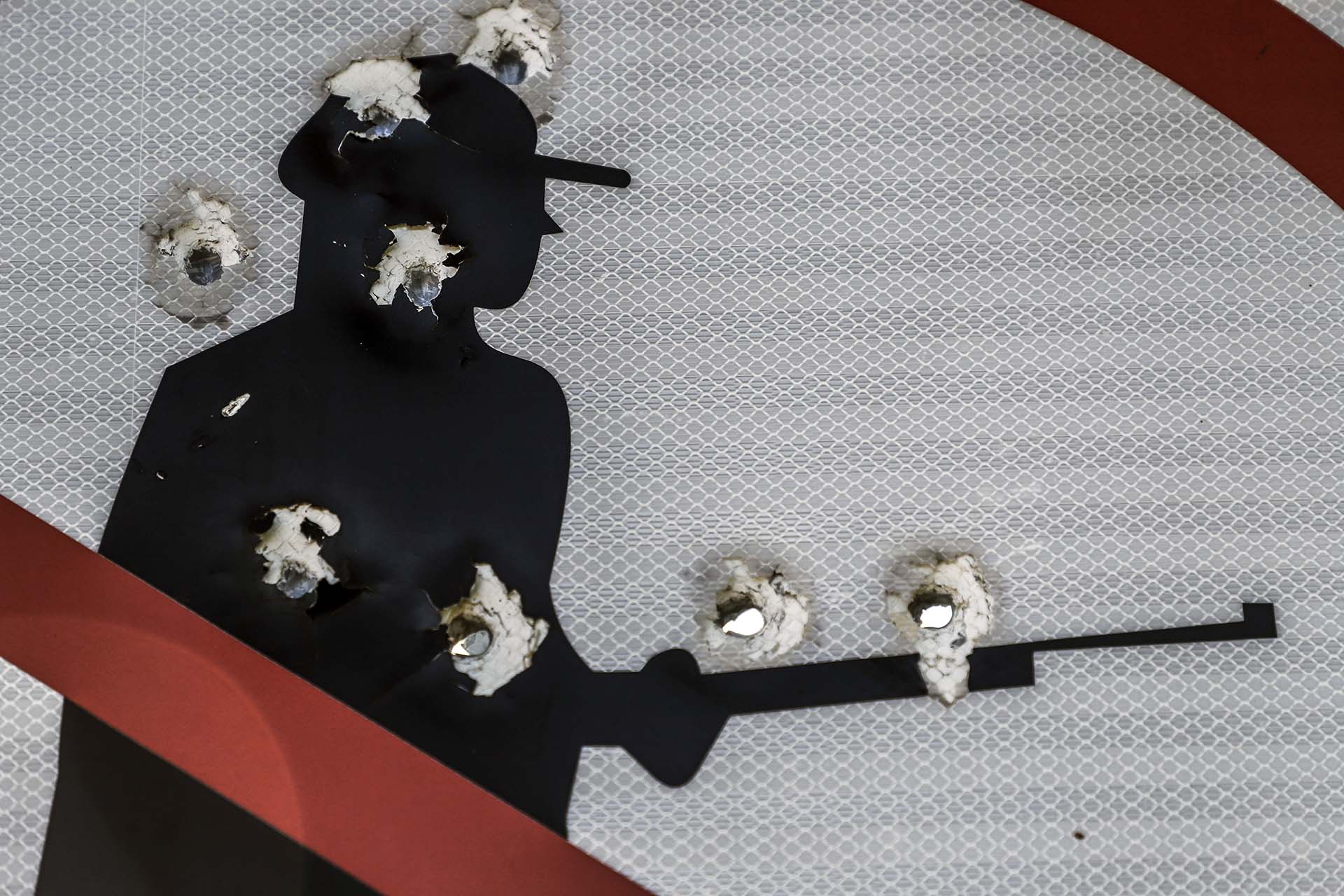 A road sign is seen with bullet holes in Badiraguato -Mexican mobster Joaquin "El Chapo" Guzman's hometown-, Sinaloa State, Mexico on February 8, 2019. - If "El Chapo" returned to Badiraguato it would be a relief for its inhabitants because, according to them, there was neither poverty nor violence when he was there. Guzman was found guilty Tuesday by a New York jury of crimes spanning a quarter of a century as head of one of the world's most powerful drugs gangs. (Photo by RASHIDE FRIAS / AFP)