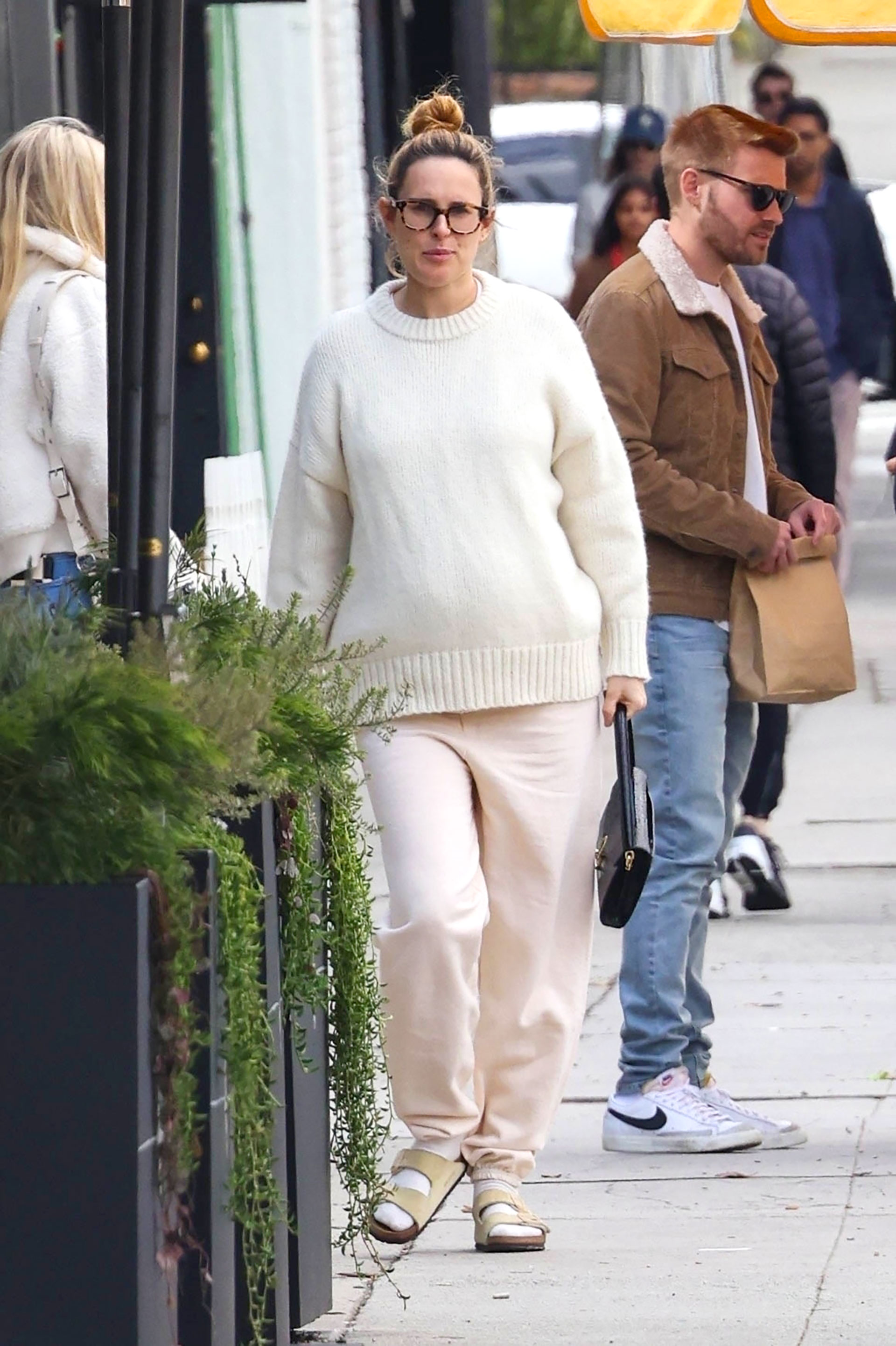Rumer Willis toured a West Hollywood shopping mall.  He stopped for a coffee in a store, shopped, and kept walking.  She wore a white pants and sweater over her pregnant bump: she is expecting her first child with musician Derek Richard Thomas (Photos: The Grosby Group)