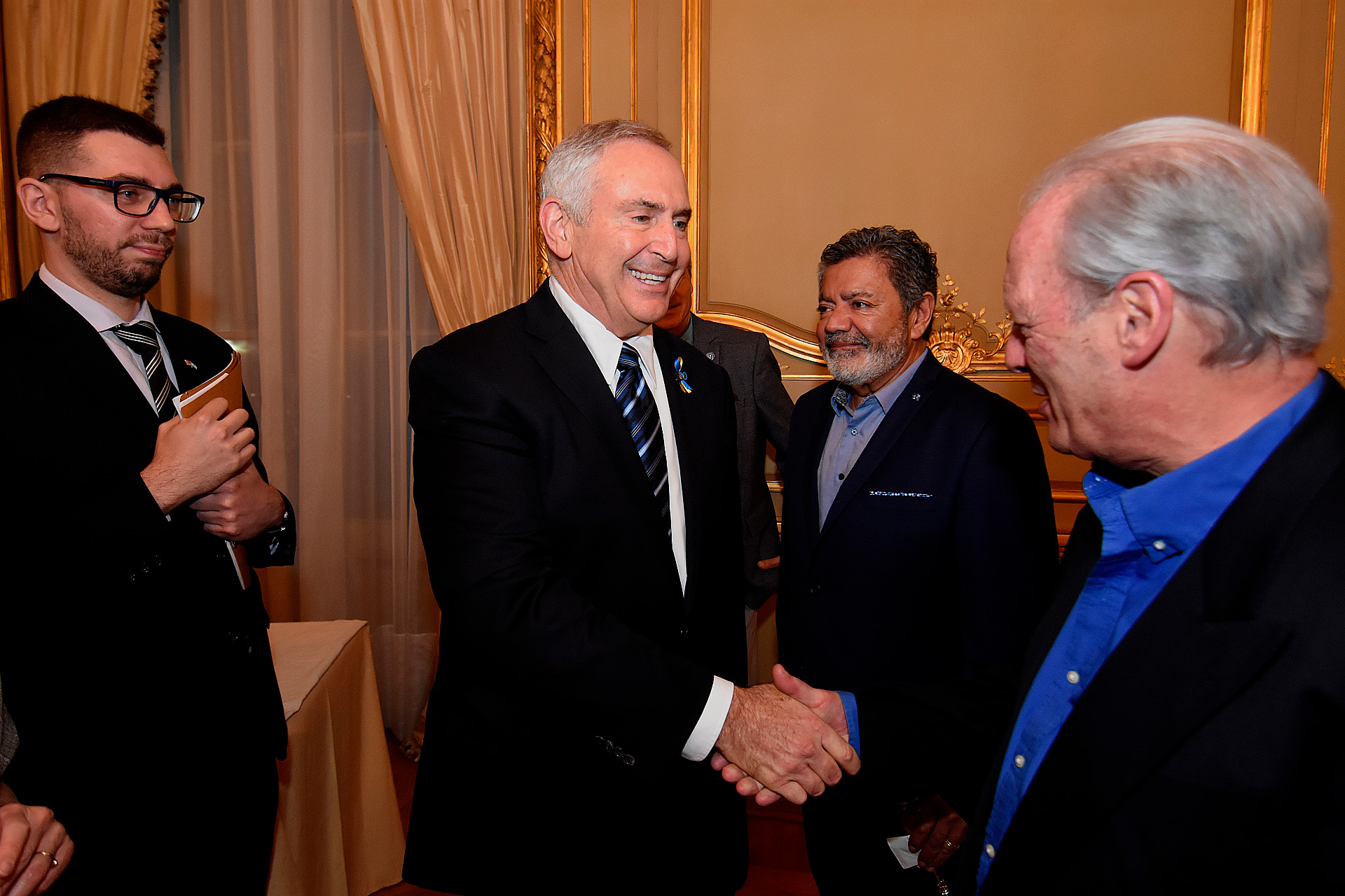 Ambassador Stanley together with Andrés Rodríguez, from UPCN, and Gerardo Martínez, from UOCRA