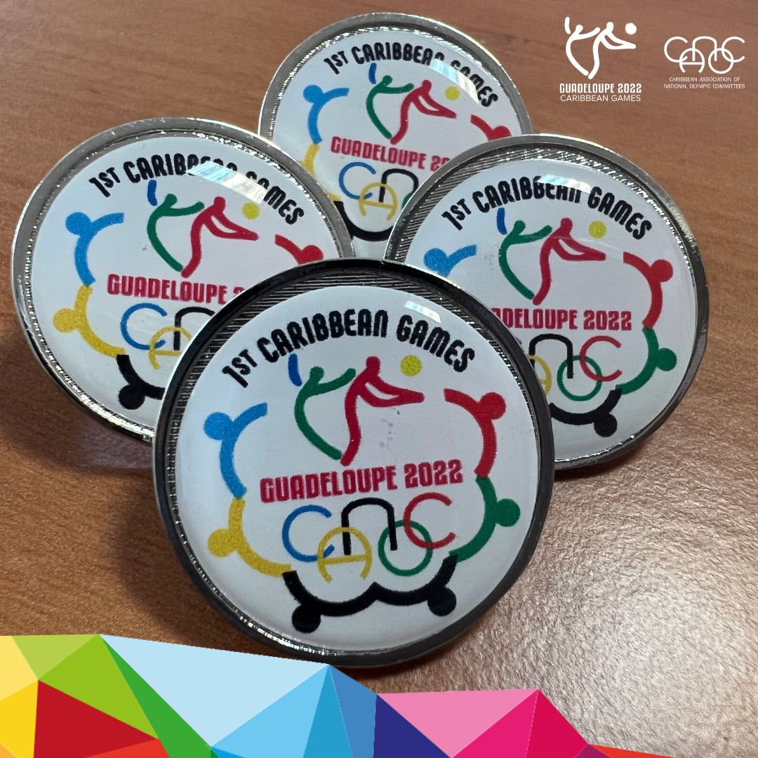 Commemorative pins made for the 2022 Caribbean Games. Photo Credit: CANOC