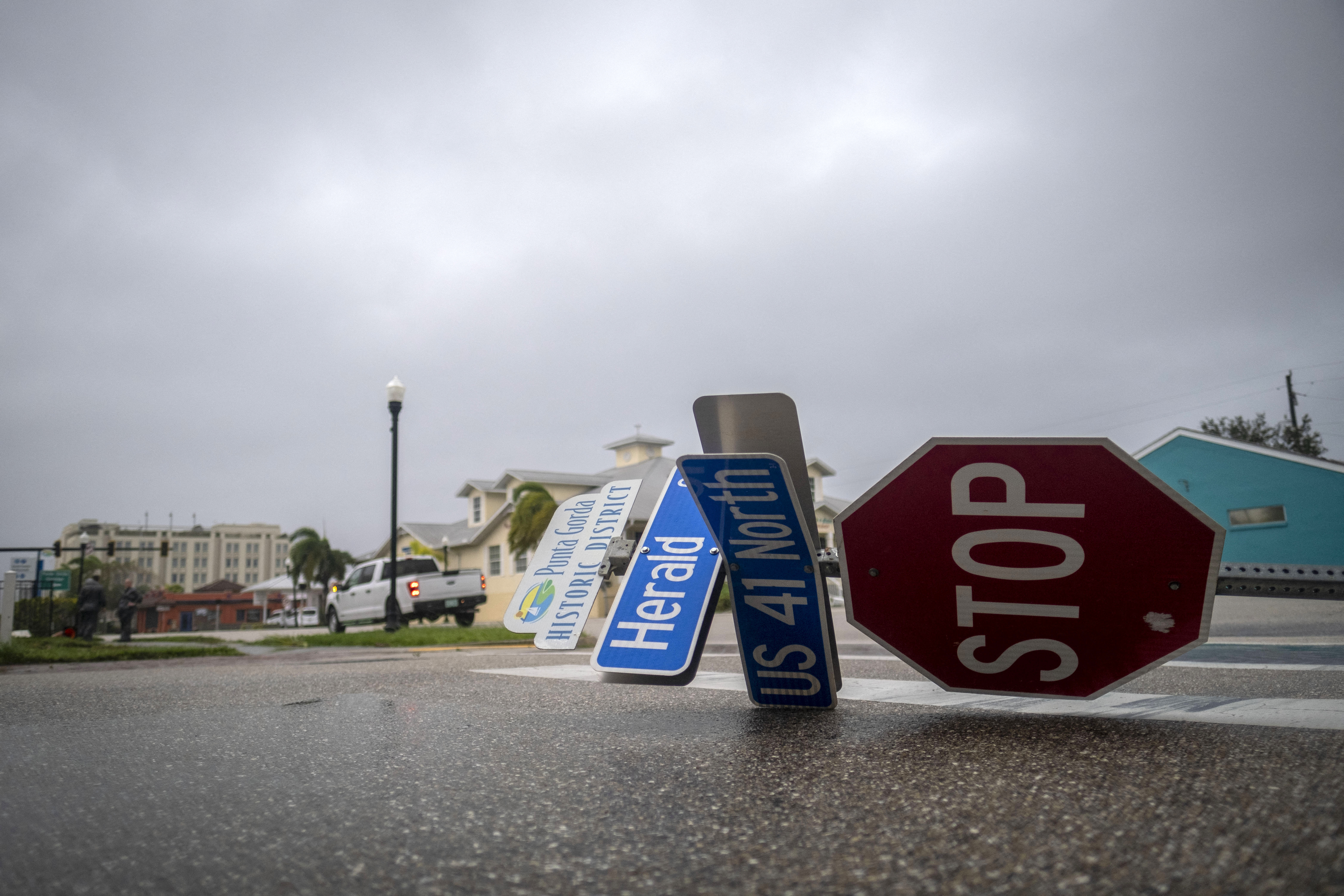 An overturned street sign is seen as the eye of Hurricane Ian passes in Punta Gorda, Florida