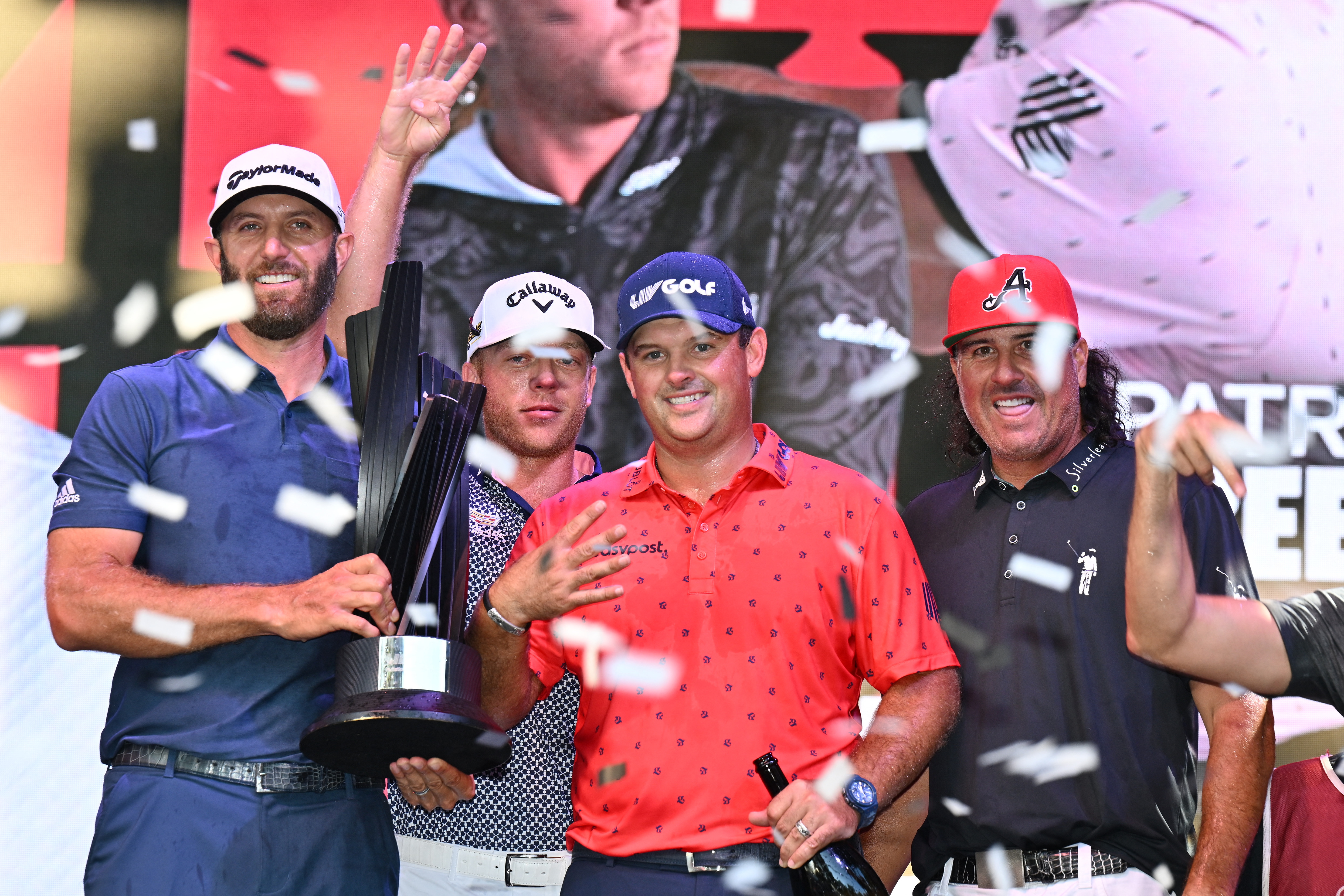 Sep 18, 2022; Chicago, Illinois, USA; From left, Dustin Johnson, Talor Gooch, Patrick Reed and Pat Perez celebrate their team win after the final round of the Invitational Chicago LIV Golf tournament at Rich Harvest Farms. Mandatory Credit: Jamie Sabau-USA TODAY Sports