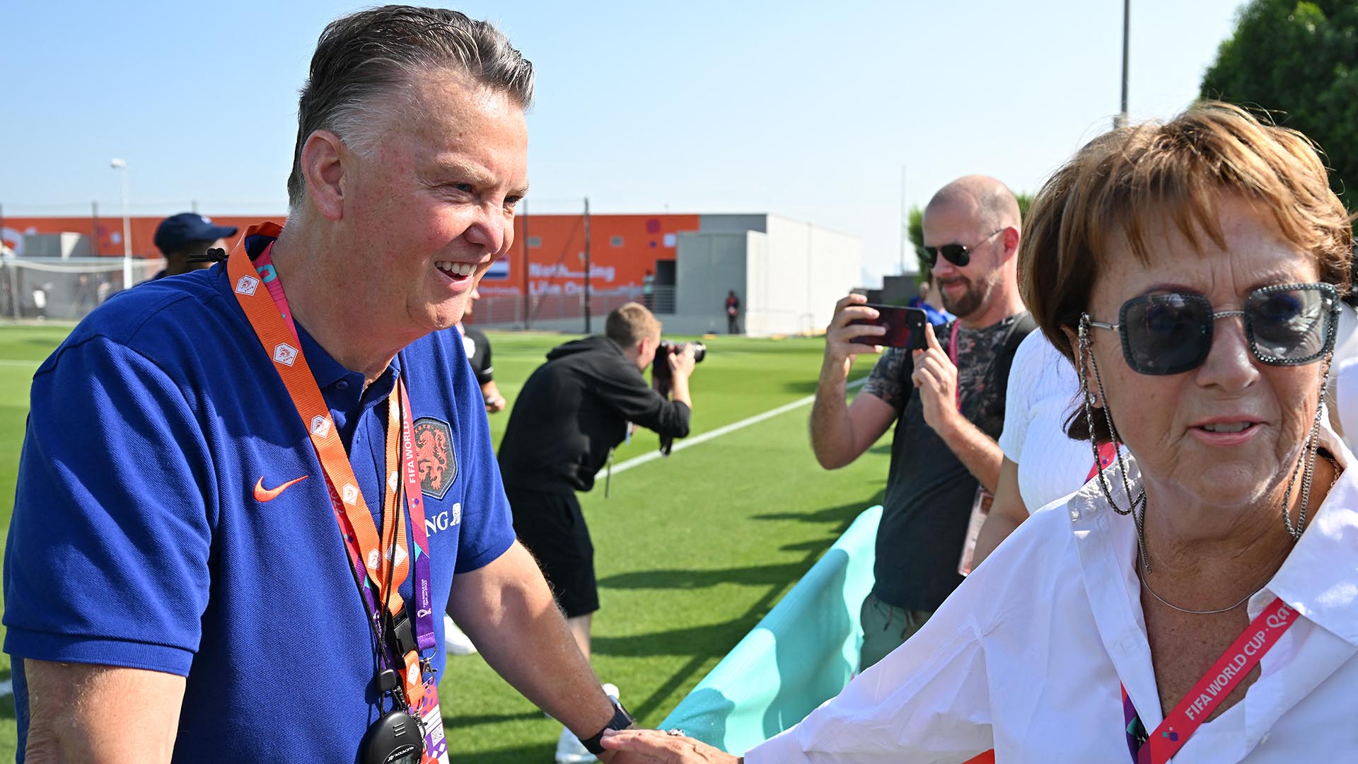 Netherlands' coach Louis Van Gaal (L) talks with his wife Truss Van Gaal during a meeting with relatives after a training session at Qatar University training ground in Doha on November 22, 2022 during the Qatar 2022 World Cup football tournament. (Photo by Alberto PIZZOLI / AFP)