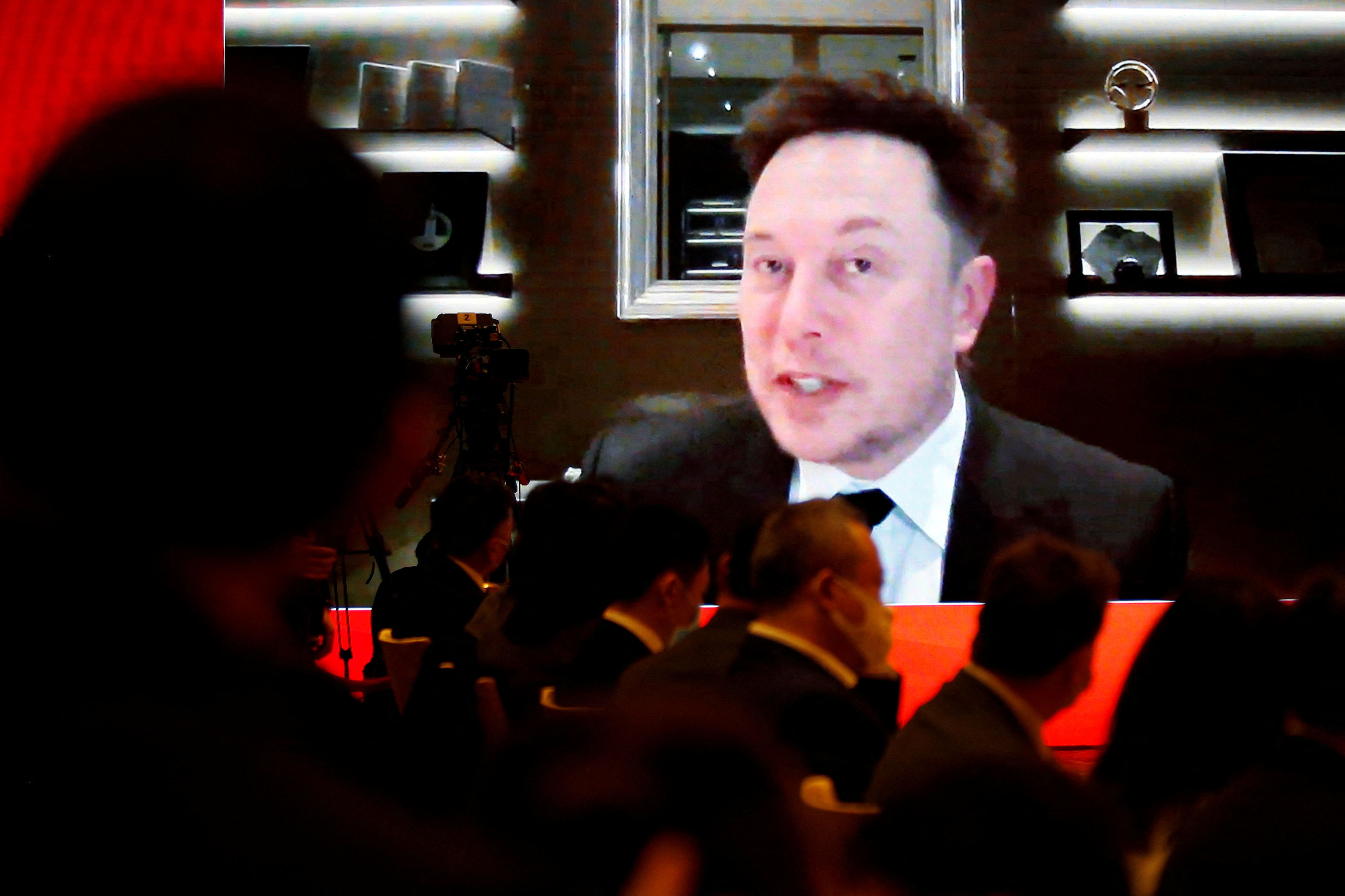 FOTO DE ARCHIVO: El director ejecutivo de Tesla Inc, Elon Musk, asiste a través de un enlace de video a una sesión en el Foro de Desarrollo de China celebrado en Beijing, China, el 20 de marzo de 2021. REUTERS/Roxanne Liu/ File Photo