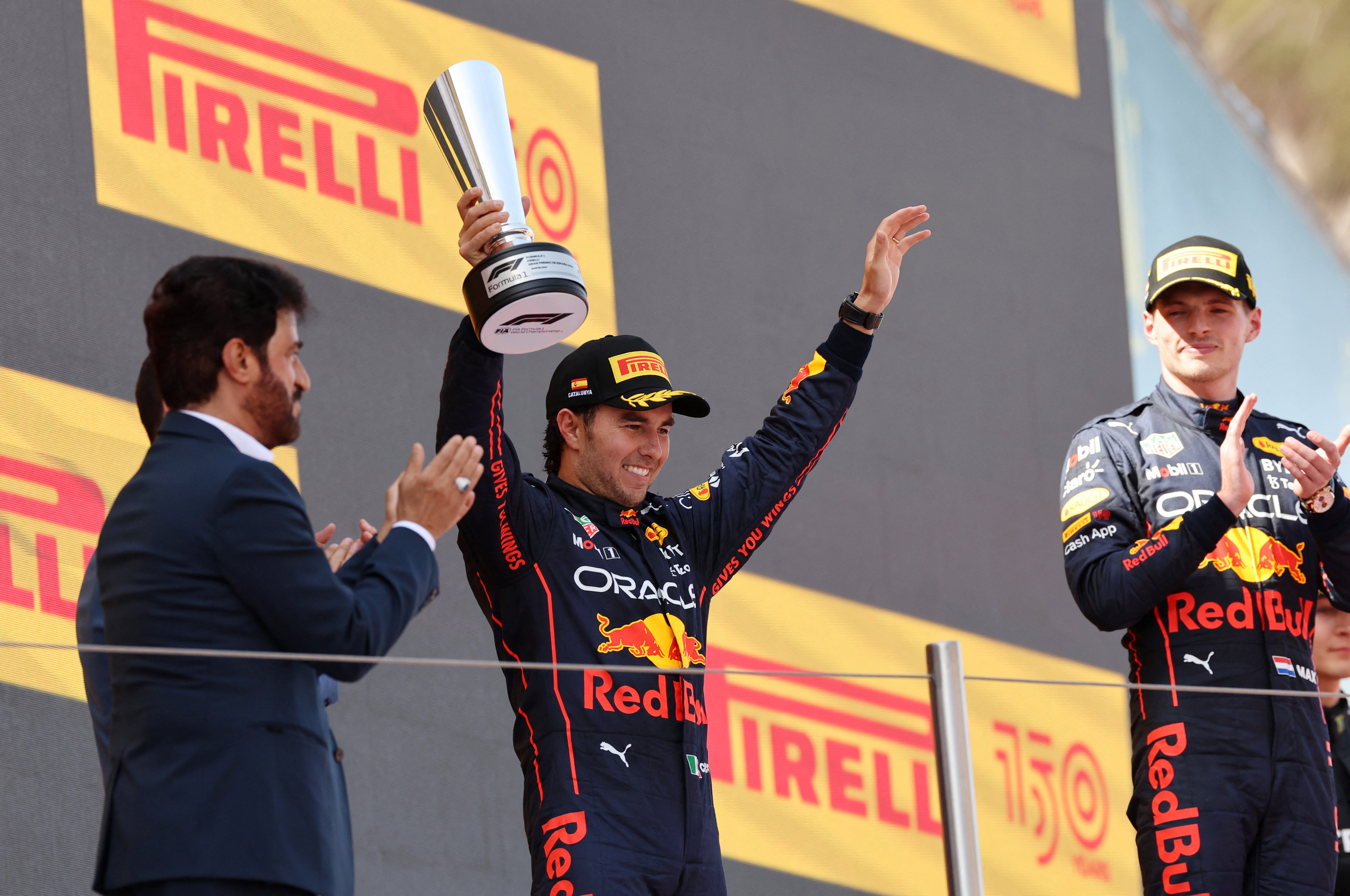 Formula One F1 - Spanish Grand Prix - Circuit de Barcelona-Catalunya, Barcelona, Spain - May 22, 2022 Second placed Sergio Perez of Red Bull celebrates on the podium alongside first placed Max Verstappen of Red Bull after the race REUTERS/Nacho Doce