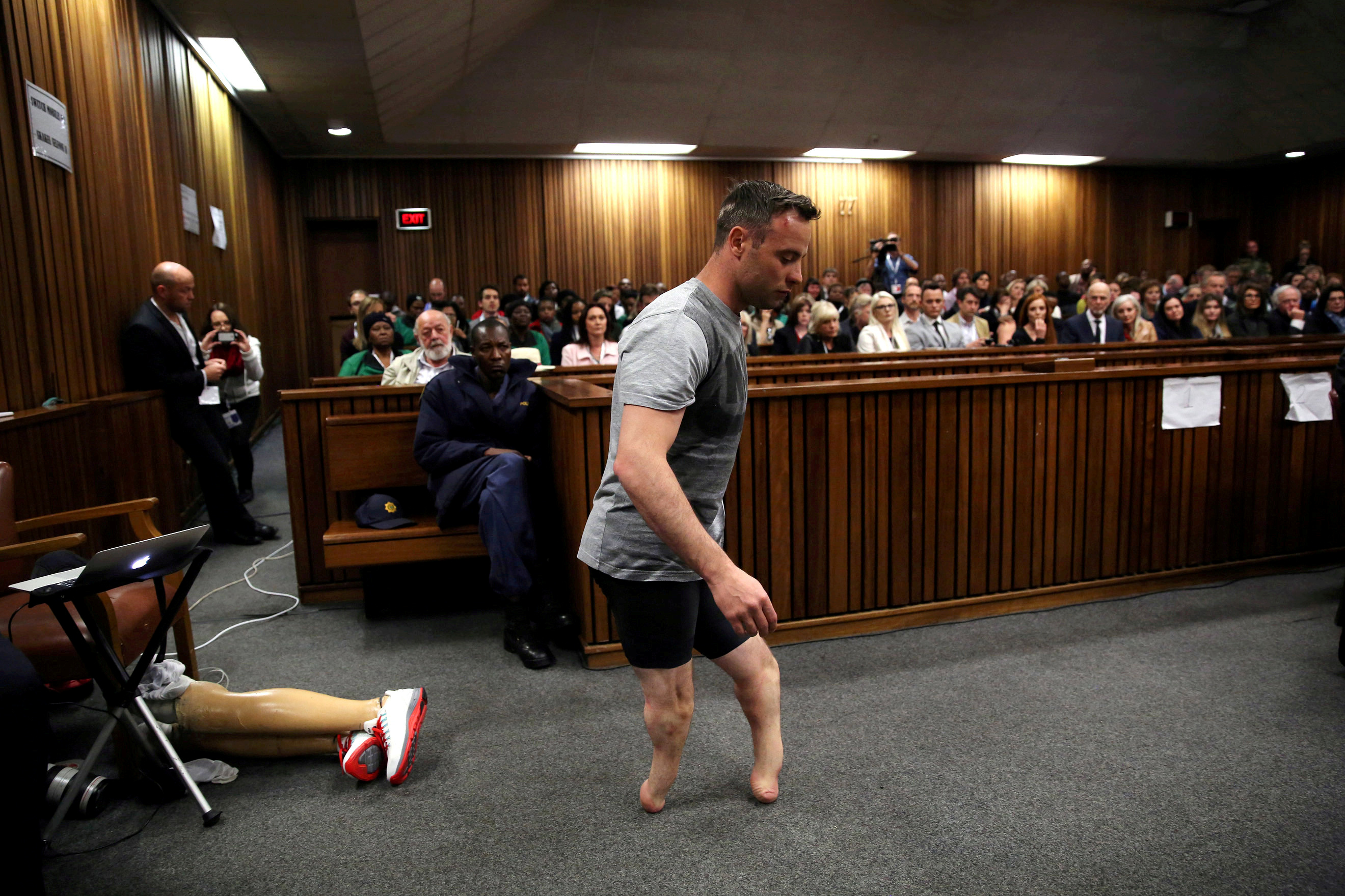 Paralympic gold medalist Oscar Pistorius walks across the courtroom without his prosthetic legs during the third day of the re-sentencing hearing for the 2013 murder of his girlfriend Reeva Steenkamp, at Pretoria High Court, South Africa, June 15, 2016. Picture taken June 15, 2016. REUTERS/Siphiwe Sibeko/File Photo  SEARCH "POY DECADE" FOR THIS STORY. SEARCH "REUTERS POY" FOR ALL BEST OF 2019 PACKAGES. TPX IMAGES OF THE DAY.
