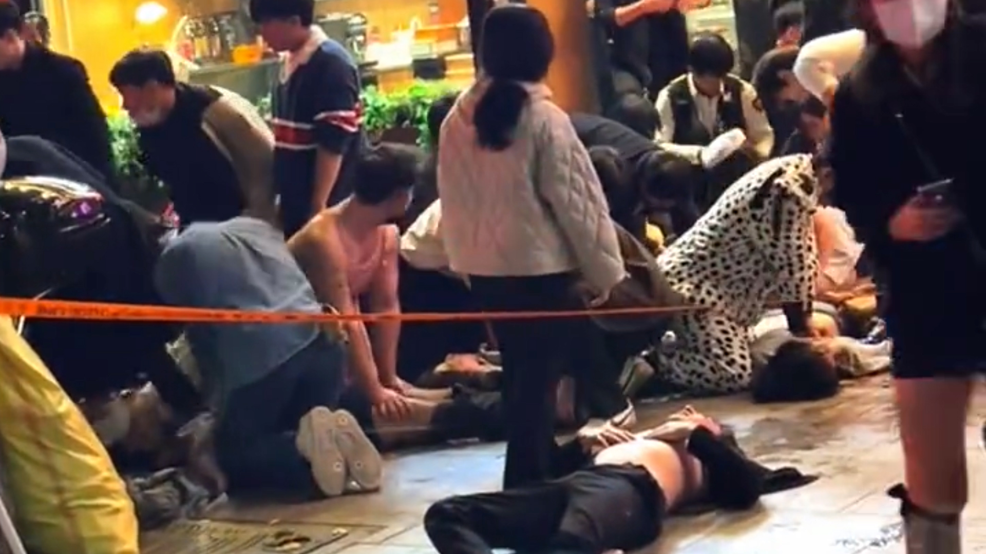 People perform CPR on victims in the streets 