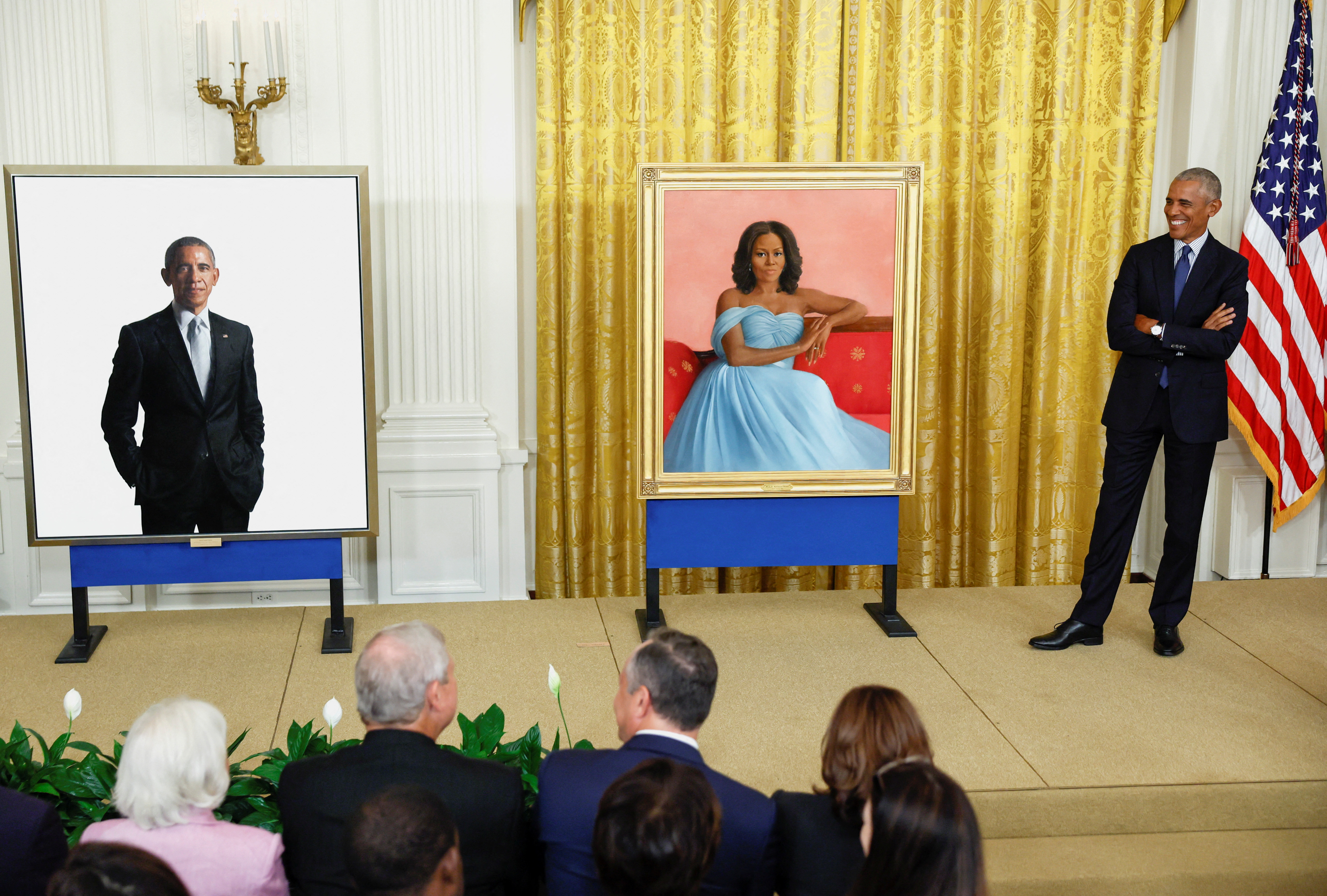 Former U.S. President Barack Obama reacts during the unveiling of his and former first lady Michelle Obama's official White House portraits, painted by Robert McCurdy and Sharon Sprung, respectively, in the East Room of the White House, in Washington, U.S., September, 7, 2022. REUTERS/Evelyn Hockstein
