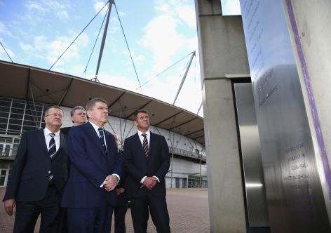 SYDNEY, AUSTRALIA - APRIL 29: IOC Vice President John Coates,  IOC President Thomas Bach and NSW Premier Mike Baird, view the Munich Memorial at ANZ Stadium on April 29, 2015 in Sydney, Australia.  (Photo by Ryan Pierse/Getty Images)