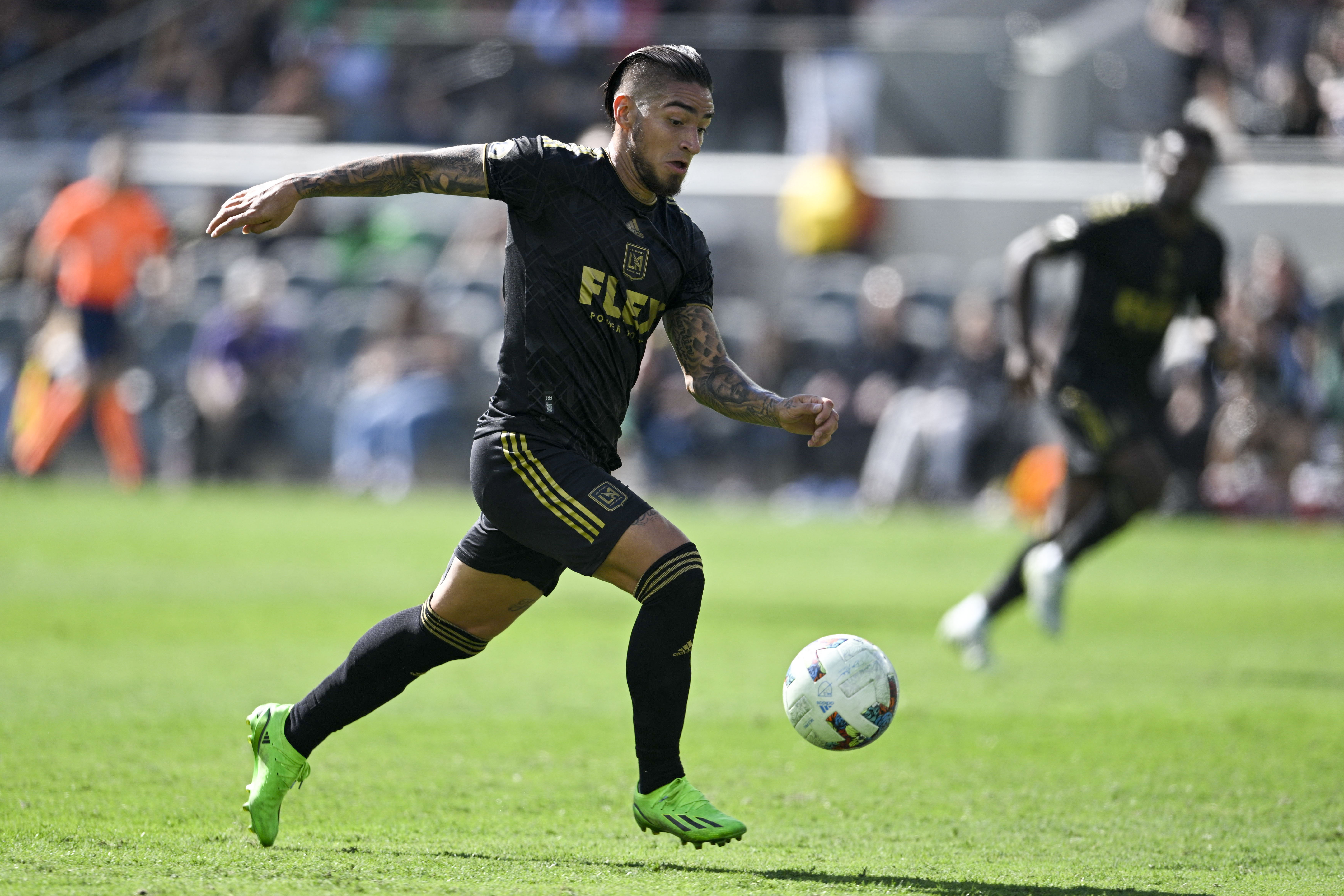 Oct 30, 2022; Los Angeles, California, USA; Los Angeles FC forward Cristian Arango (9) runs down the pitch with the ball against the Austin FC during the first half of the conference finals for the Audi 2022 MLS Cup Playoffs at Banc of California Stadium. Mandatory Credit: Kelvin Kuo-USA TODAY Sports