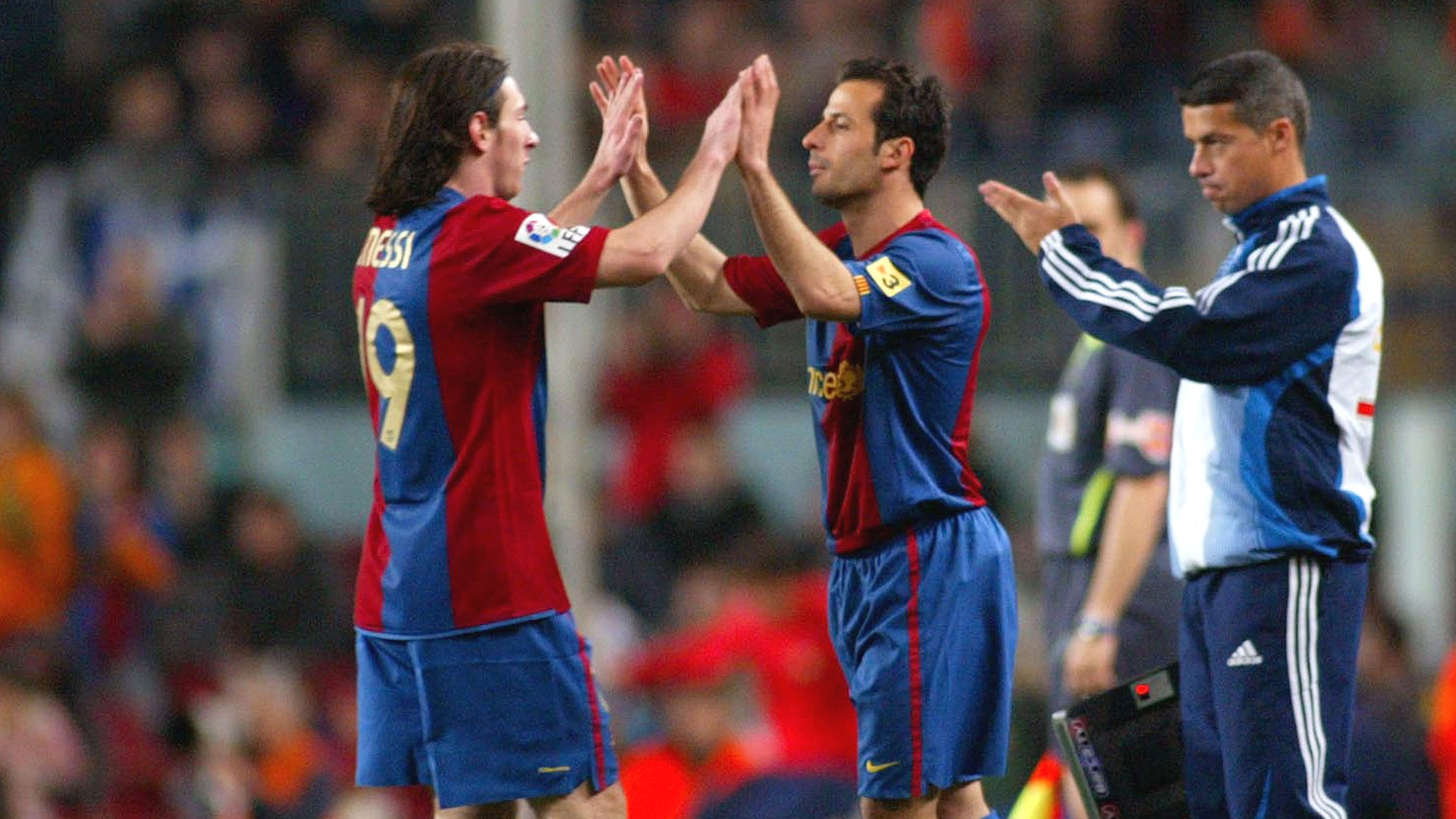 Ludovic Giuly y Lionel Messi (Getty Images)