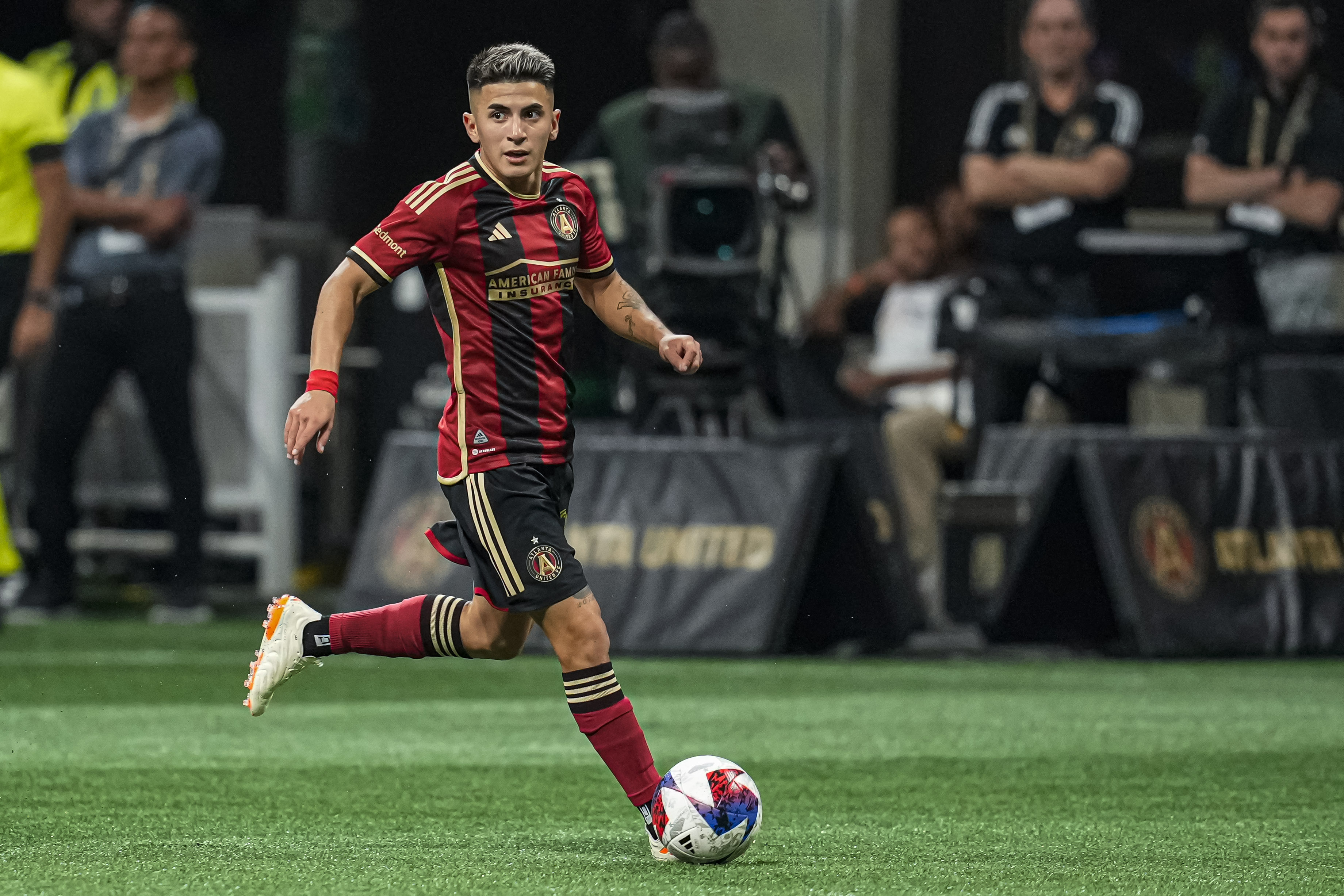 May 13, 2023; Atlanta, Georgia, USA; Atlanta United midfielder Thiago Almada (23) controls the ball against Charlotte FC at Mercedes-Benz Stadium. Mandatory Credit: Dale Zanine-USA TODAY Sports