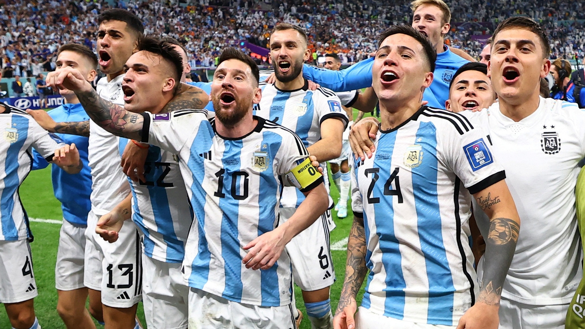 Soccer Football - FIFA World Cup Qatar 2022 - Quarter Final - Netherlands v Argentina - Lusail Stadium, Lusail, Qatar - December 10, 2022 Argentina's Lionel Messi, Enzo Fernandez and teammates celebrate qualifying for the semi finals REUTERS/Molly Darlington     TPX IMAGES OF THE DAY