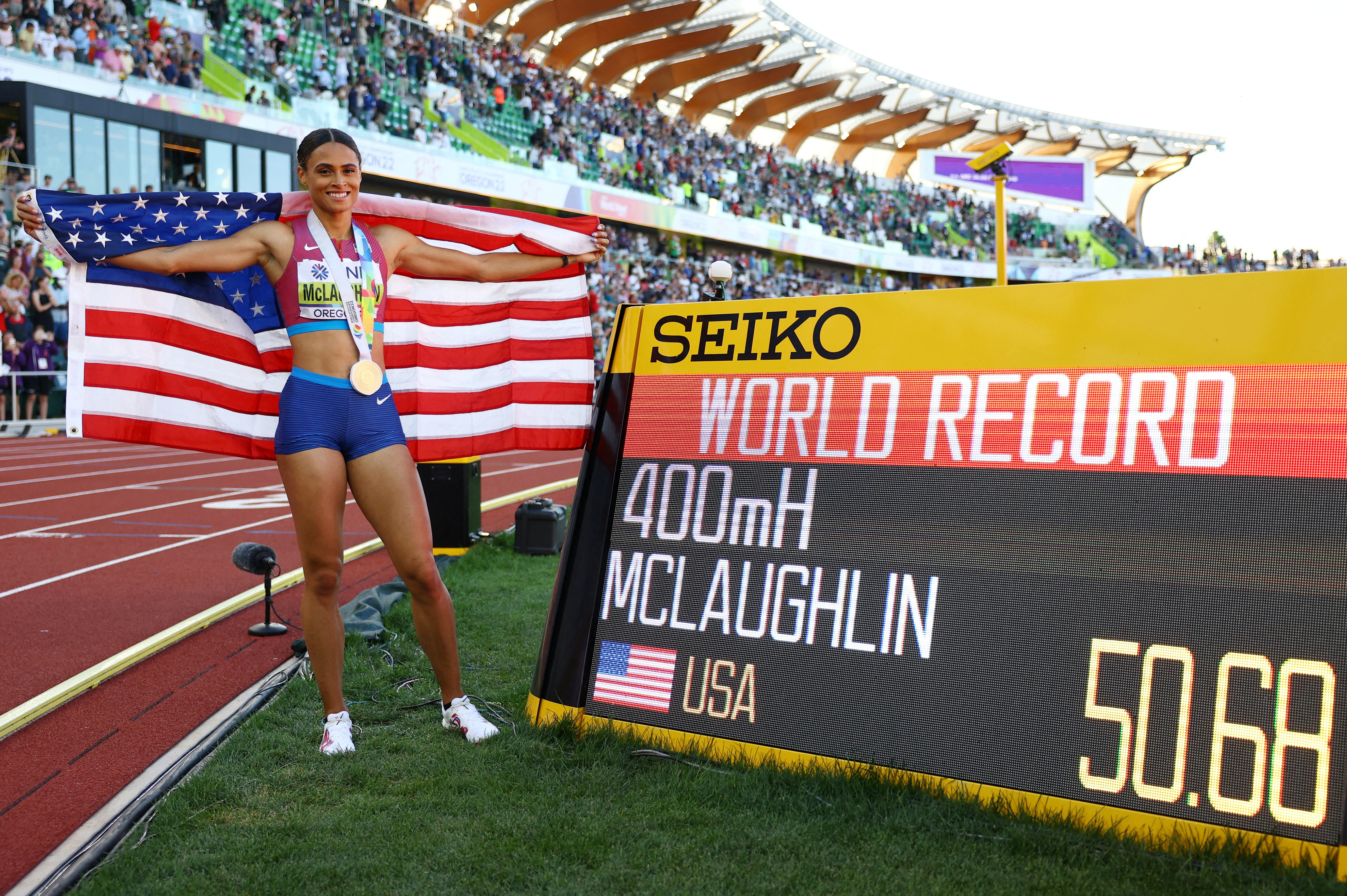 Athletics - World Athletics Championships - Women's 400 Metres Hurdles - Final - Hayward Field, Eugene, Oregon, U.S. - July 22, 2022 Gold medallist Sydney McLaughlin of the U.S. celebrates after winning the women's 400 metres hurdles final and setting a new world record REUTERS/Kai Pfaffenbach TPX IMAGES OF THE DAY