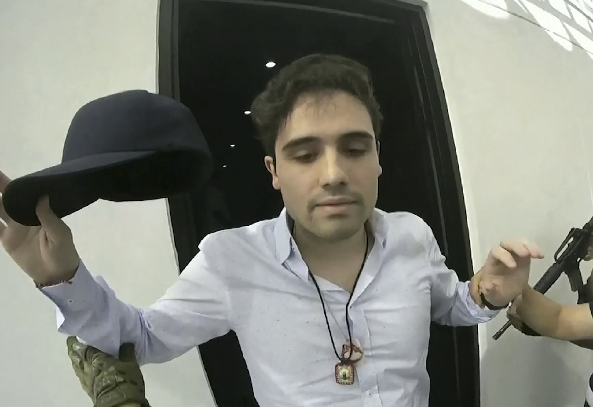   On October 17, 2019, a video fragment provided by the Mexican government shows Ovidio Guzmán López at the moment of his arrest, in Culiacán, Mexico.  Mexican security forces were forced to release the son of Sinaloa cartel leader Joaquín "El Chapo" Guzmán that day after a shooting in the western city of Culiacán.  (CEPROPIE via AP File)