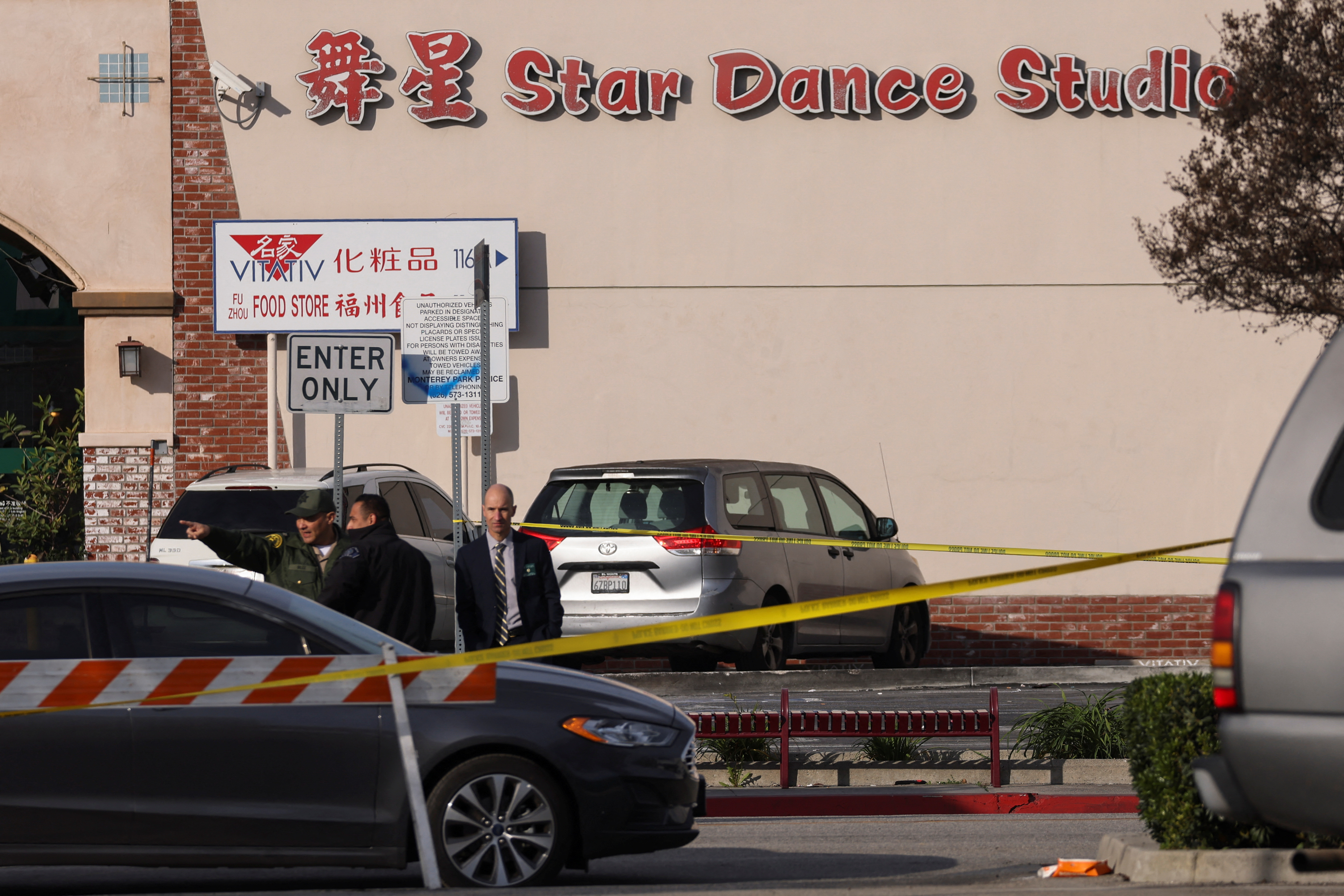 Members of the police gather outside the scene of a shooting that took place during a Chinese Lunar New Year celebration, in Monterey Park, California, U.S., January 22, 2023 (REUTERS/Mike Blake)