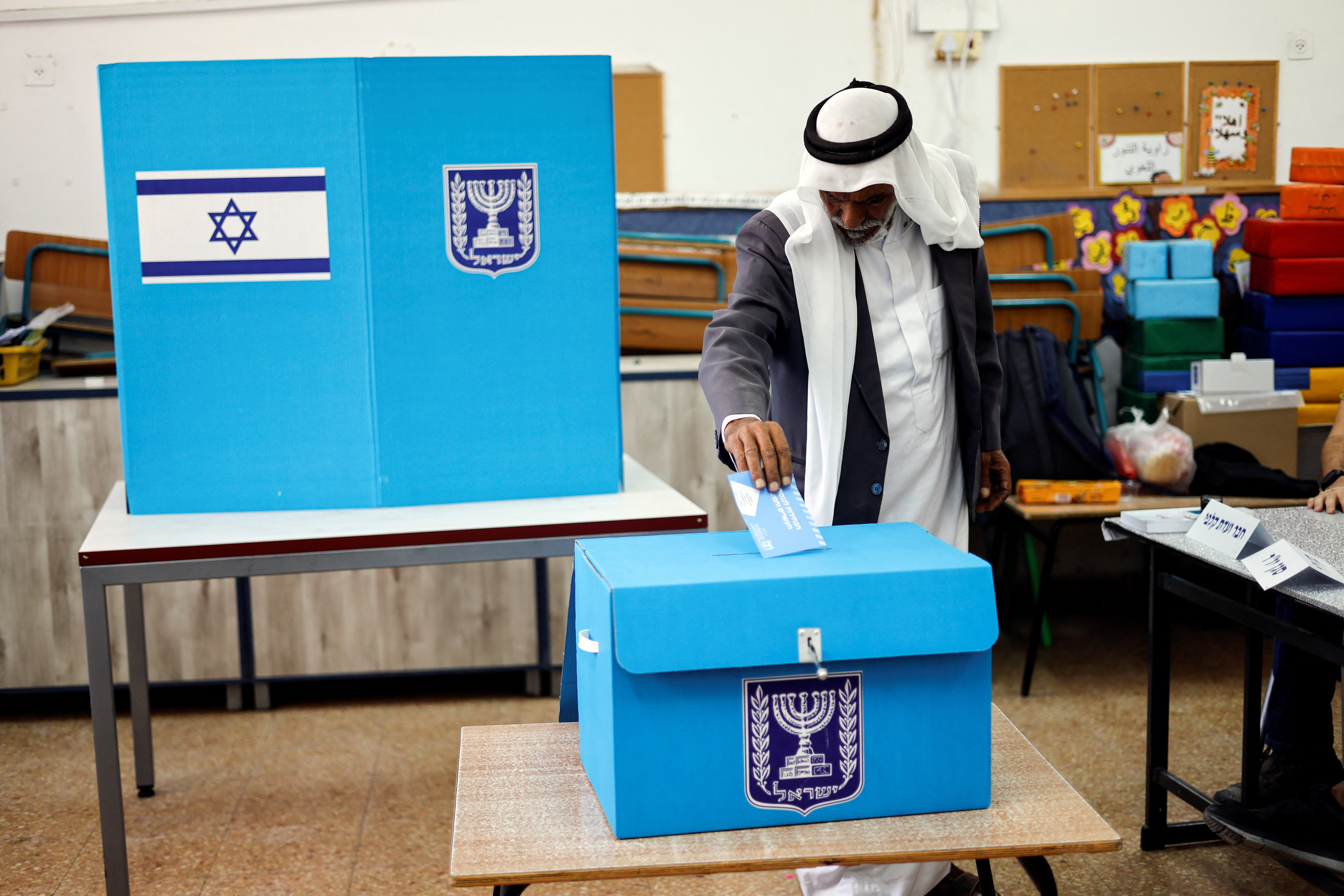 An Israeli man casting his ballot on the day of Israel's general election in a polling station in Rahat, Israel November 1, 2022. REUTERS/Amir Cohen