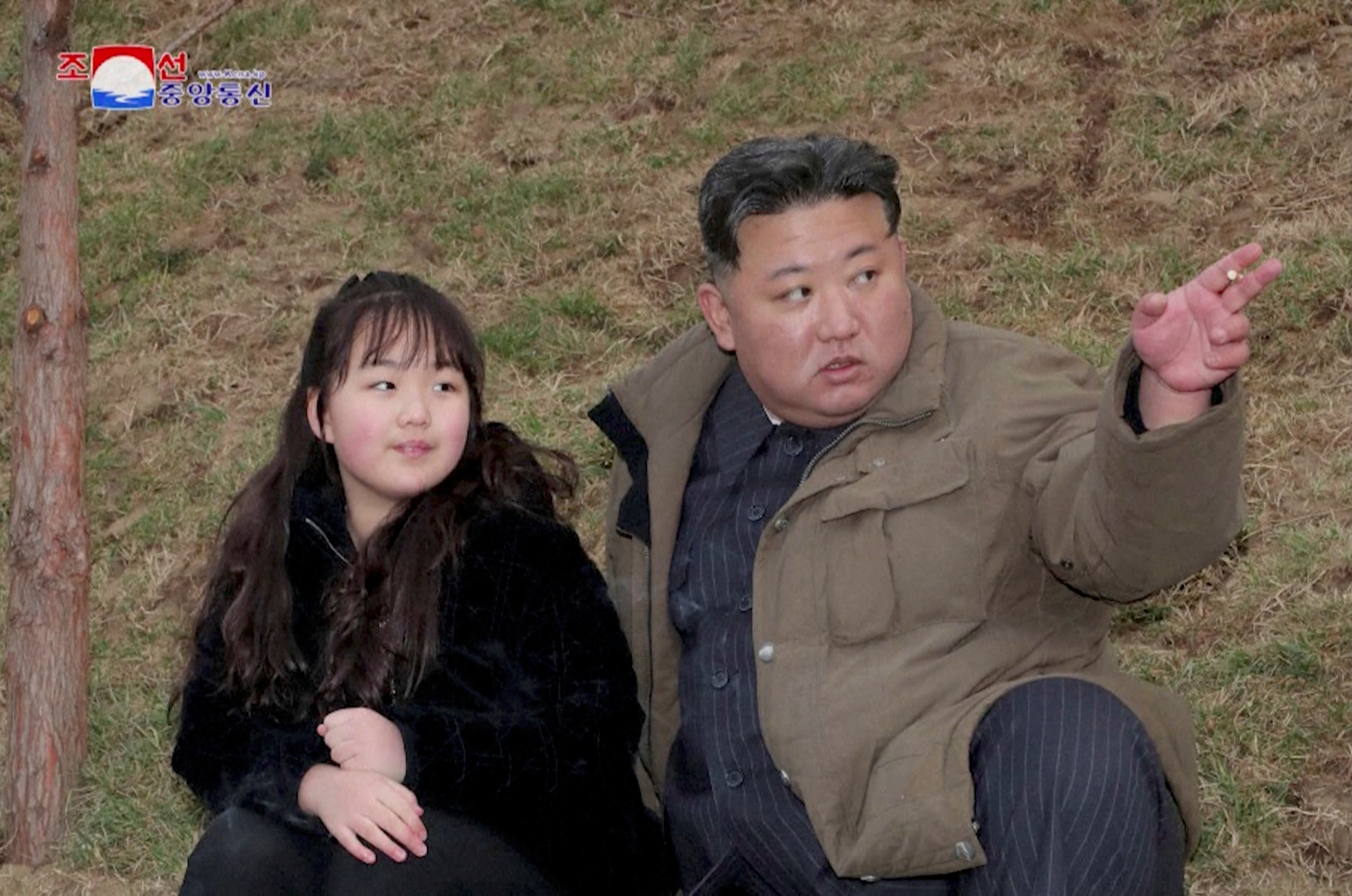 Father and daughter at a Hwasong-18 intercontinental ballistic missile test (KCNA/Reuters)
