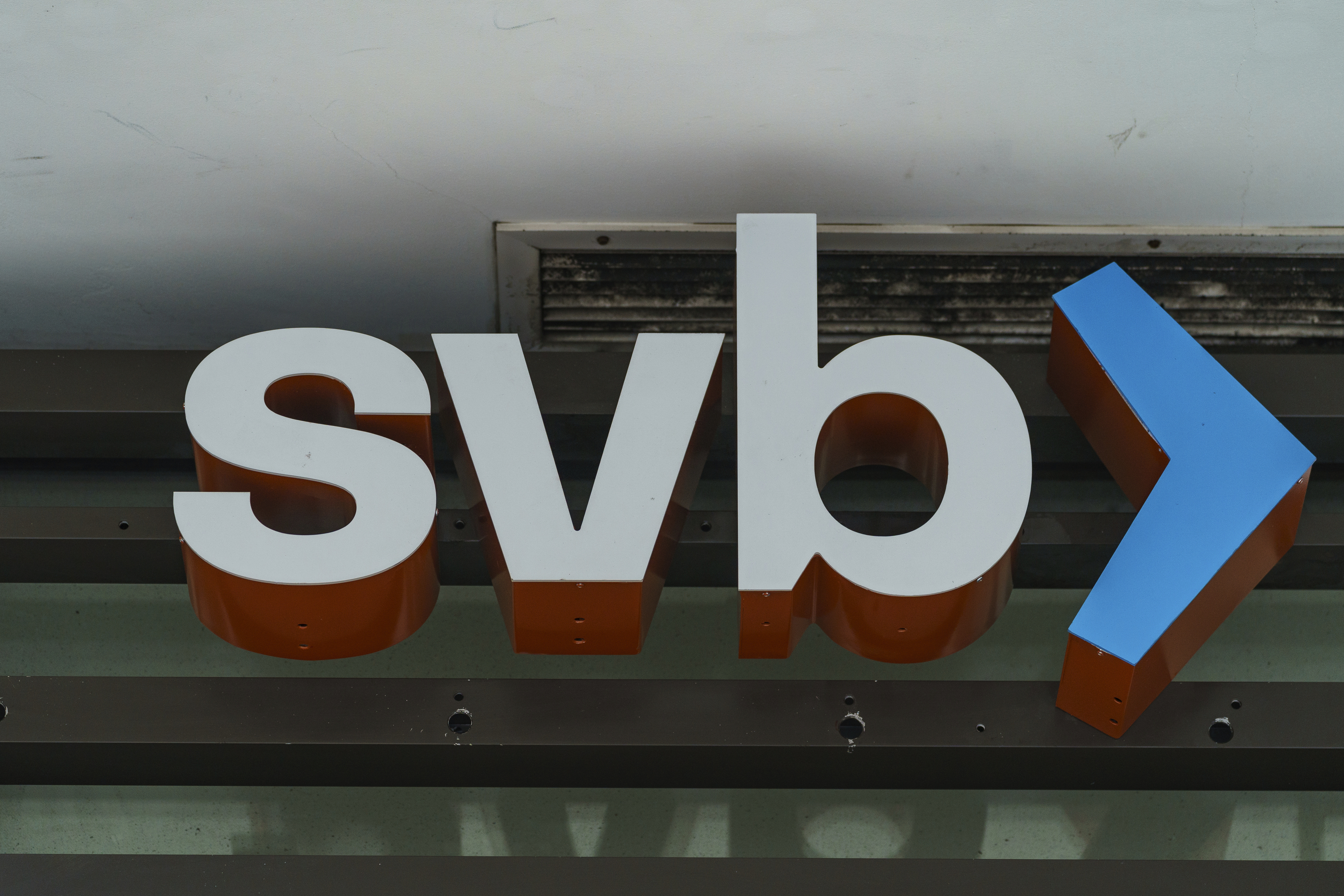 FILE - The Silicon Valley Bank logo is seen at a branch in Pasadena, Calif., on March 13, 2023. The Federal Deposit Insurance Corporation said Monday, March 27, that First Citizens would buy much of Silicon Valley Bank, whose bankruptcy rocked the banking sector.  (AP Photo/Damian Dovarganes, File)