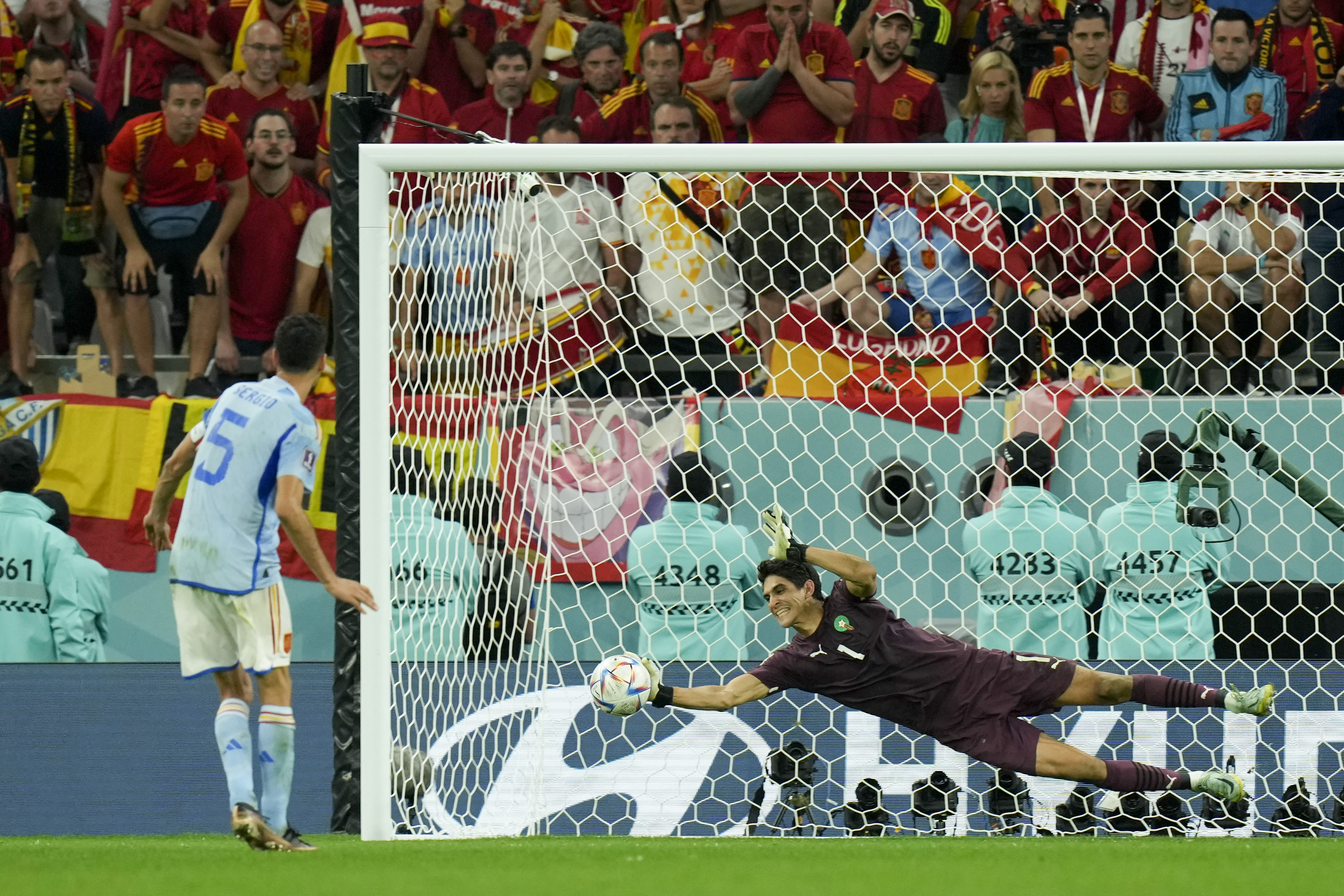 Bono covers the penalty executed by the Spanish Sergio Busquets during a shootout from the 12 steps in the match for the round of 16 of the World Cup