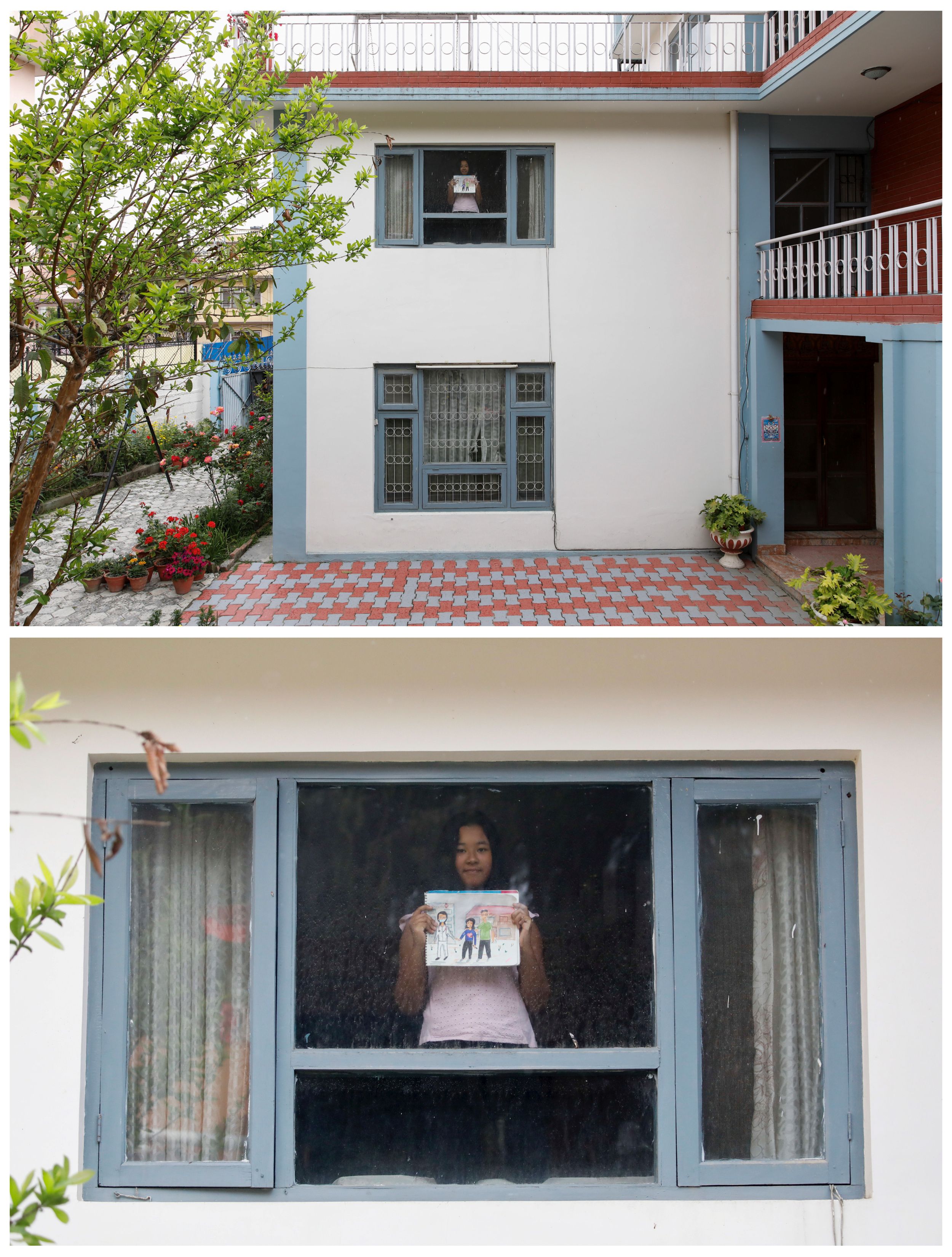 Kyra Bajracharya, 11, sostiene un dibujo que hizo durante el brote de coronavirus, parada frente a una ventana de su casa en Kathmandu, Nepal, el 16 de abril pasado.