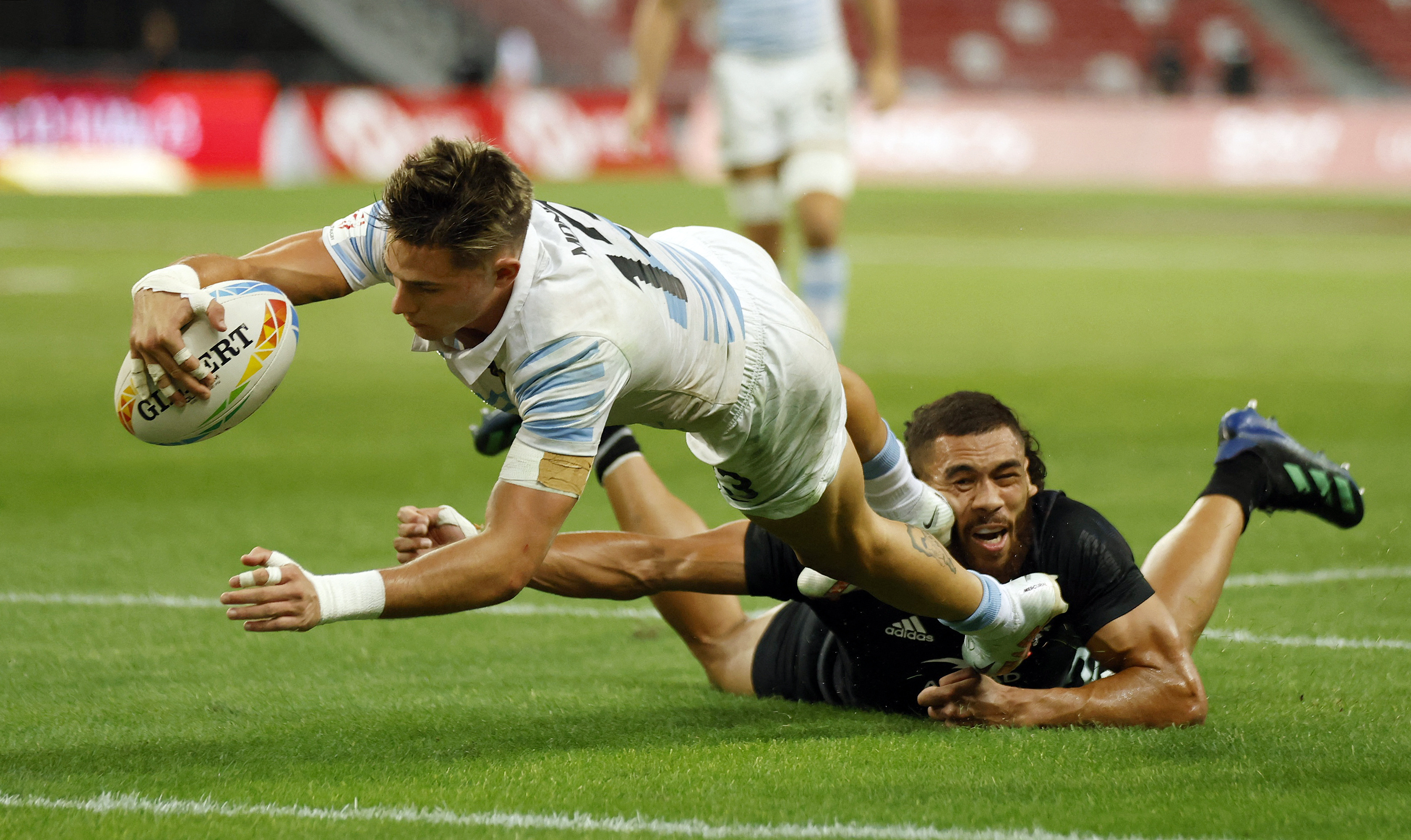 Rugby Union - Rugby World Cup Sevens - Cup Final - Argentina v New Zealand - National Stadium, Singpapore - April 9, 2023 Argentina's Marcos Moneta scores a try REUTERS/Edgar Su