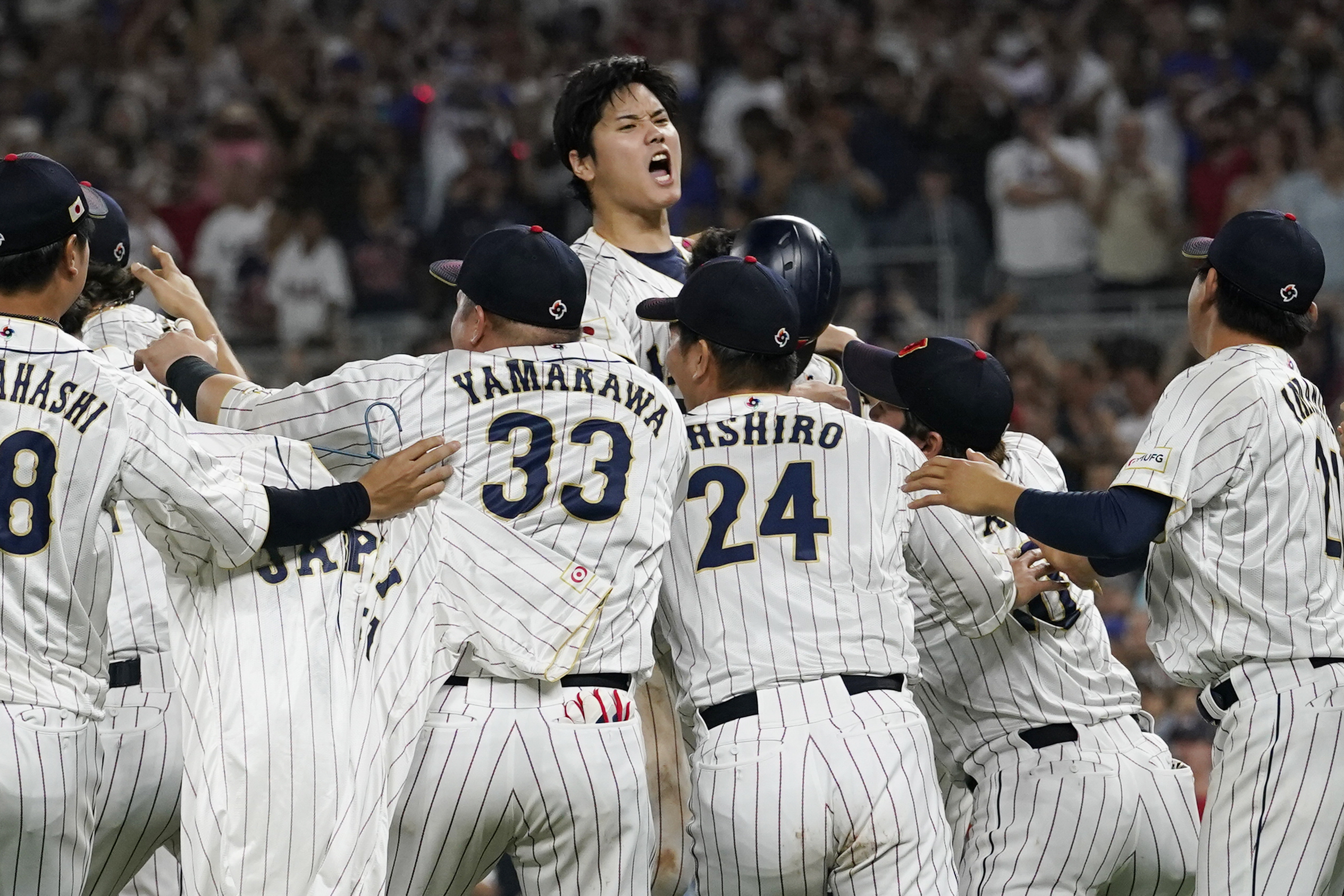 Japan's pitcher Shohei Ohtani (16) celebrates after a 3-2 victory over the United States in the final of the World Baseball Classic, Tuesday, March 21, 2023, in Miami.  (AP Photo/Marta Lavandier)