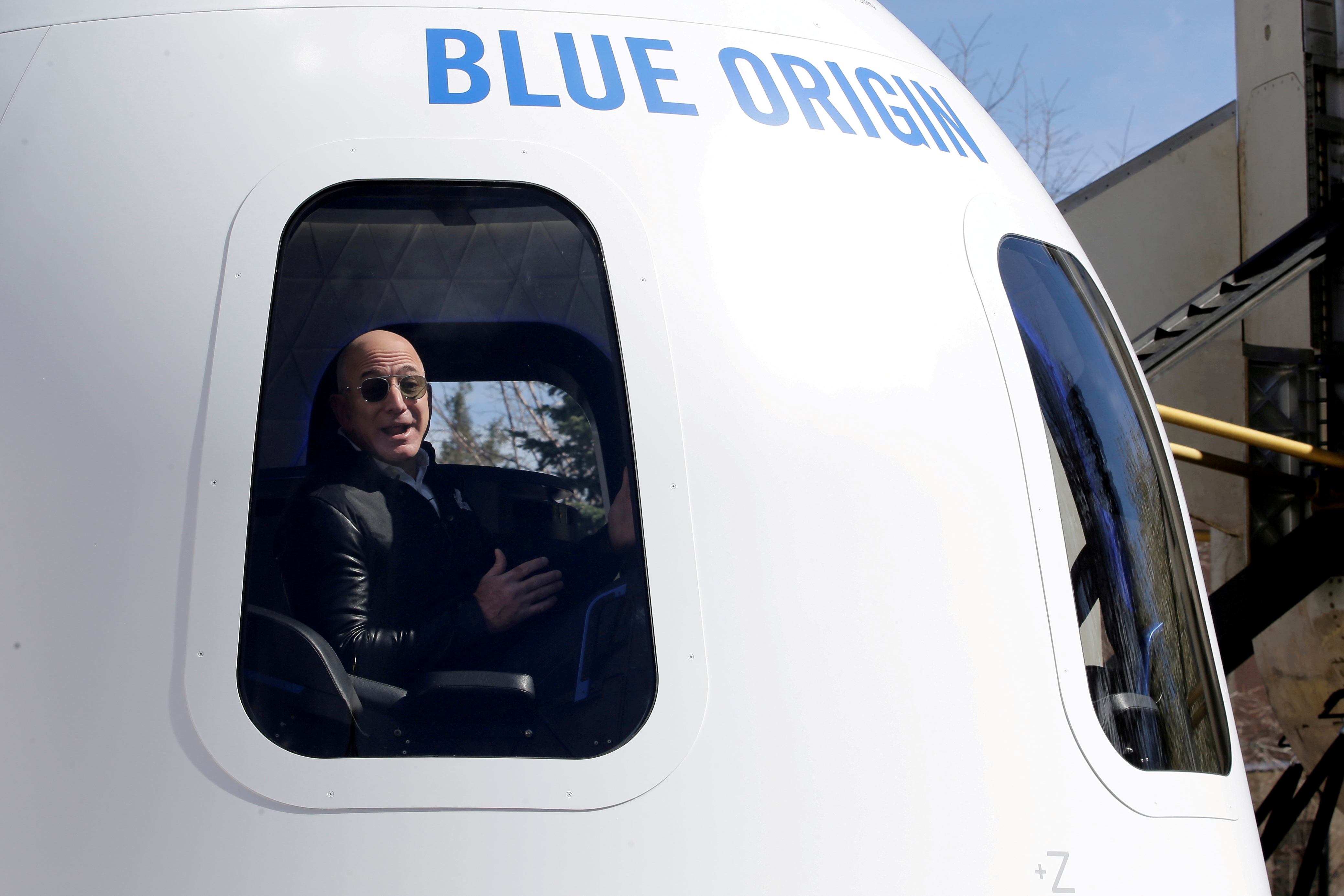 FILE PHOTO: Amazon and Blue Origin founder Jeff Bezos addresses the media about the New Shepard rocket booster and Crew Capsule mockup at the 33rd Space Symposium in Colorado Springs, Colorado, United States April 5, 2017.  REUTERS/Isaiah J. Downing/File Photo