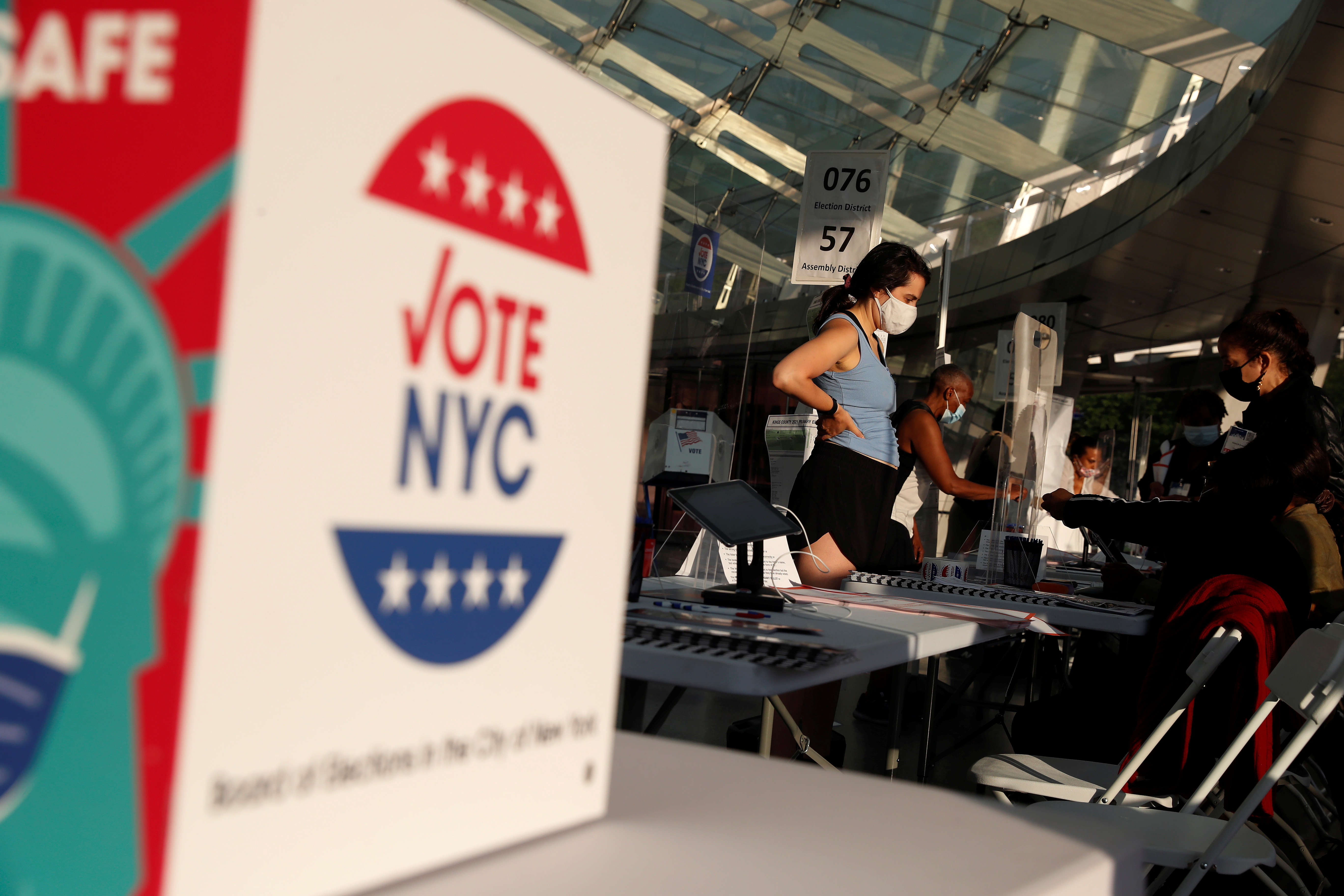 People wait to check in for voting in the New York Primary election at the Brooklyn Museum voting station in New York City, U.S., June 22, 2021. REUTERS/Shannon Stapleton
