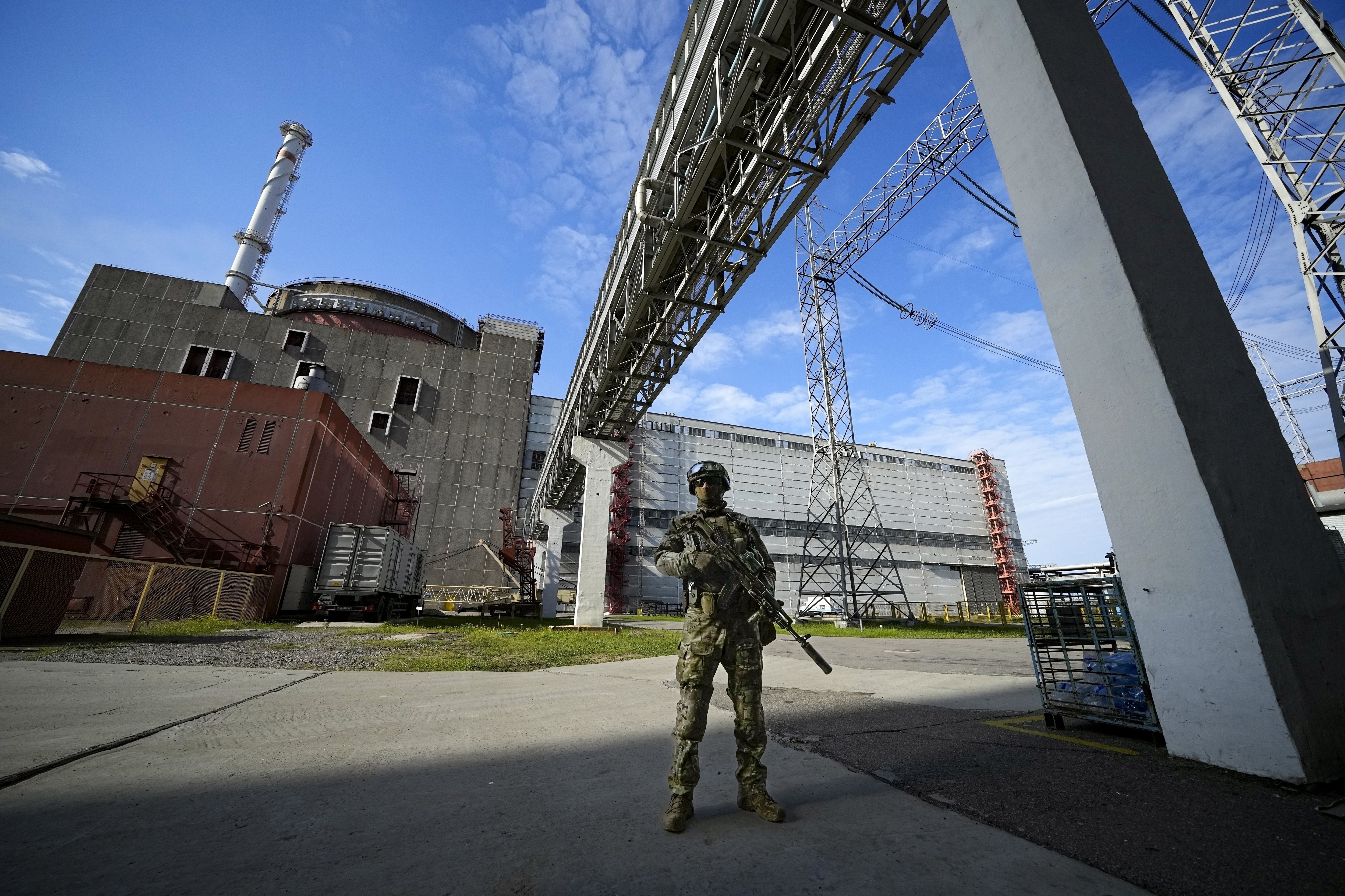 A Russian soldier guards part of the Zaporizhia nuclear power plant in Russian-controlled territory in southeastern Ukraine (AP Photo/File)