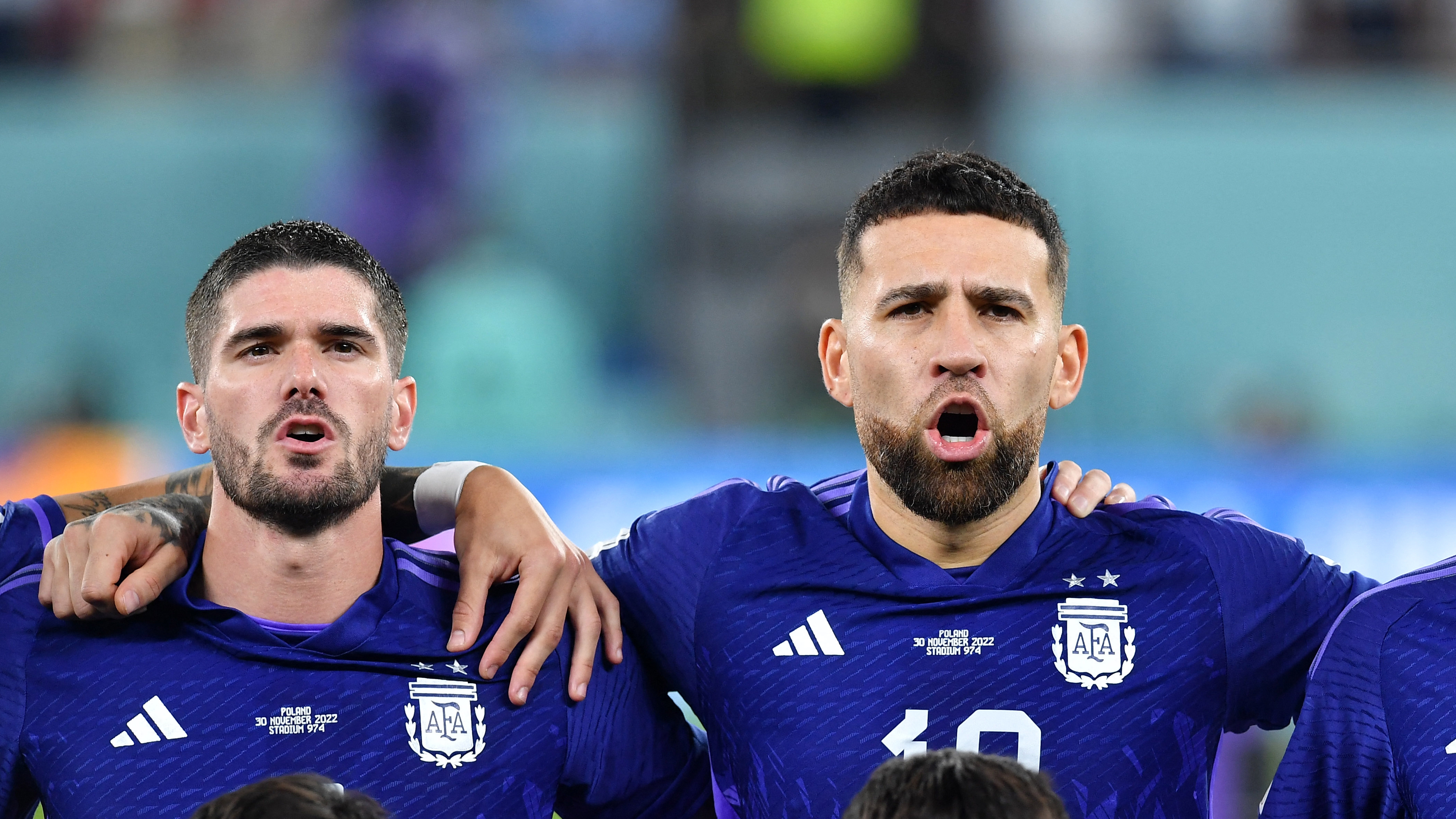 Soccer Football - FIFA World Cup Qatar 2022 - Group C - Poland v Argentina - Stadium 974, Doha, Qatar - November 30, 2022 Argentina's Rodrigo De Paul, Nicolas Otamendi and Angel Di Maria line up during the national anthem before the match REUTERS/Jennifer Lorenzini