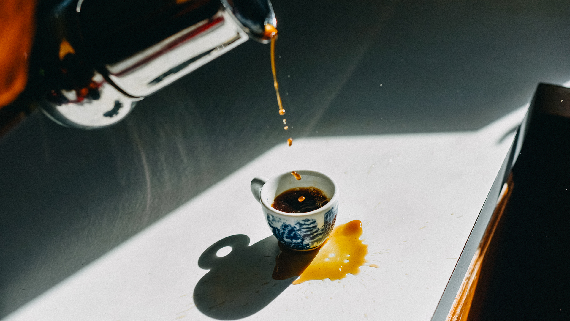 Coffee spilled outside an espresso cup as a mistake. (Getty)