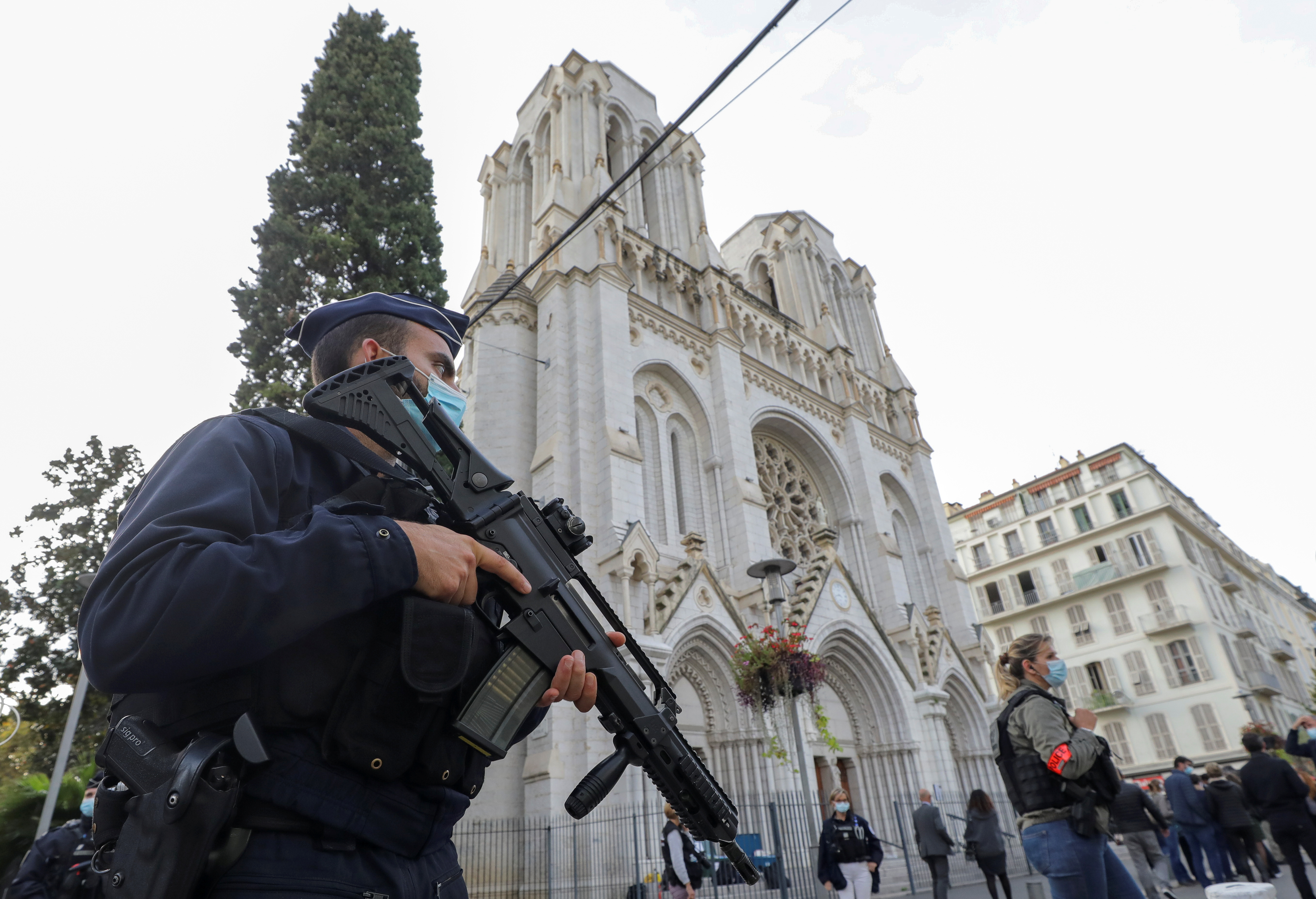 A police officer stands near Notre Dame church, where a knife attack took place, in Nice, France October 29, 2020. REUTERS/Eric Gaillard/Pool