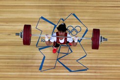China Report - Citizenship Dispute Follows Weightlifting Champ Home from Kazakhstan