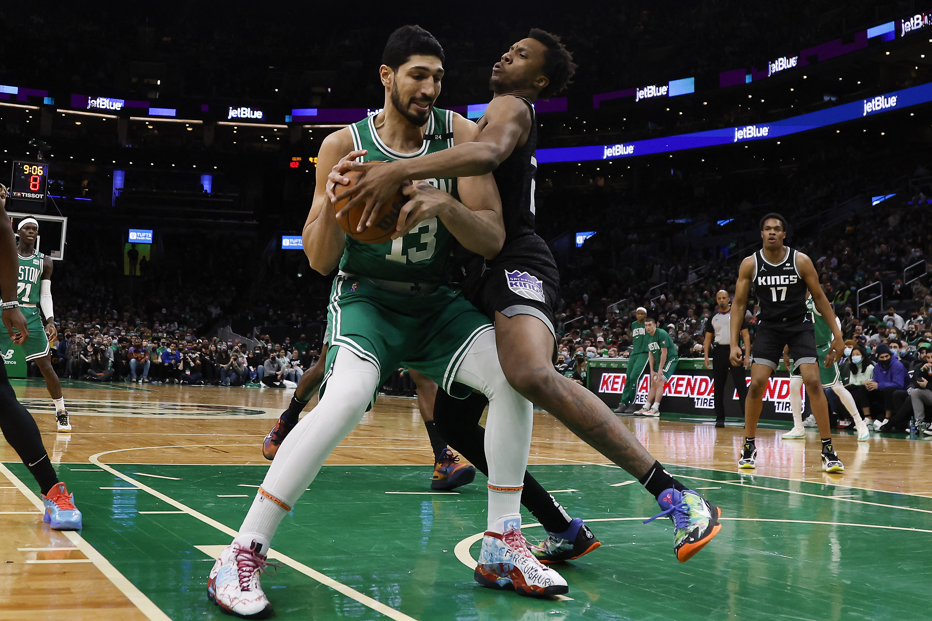 Jan 25, 2022; Boston, Massachusetts, USA; Sacramento Kings forward Louis King (23) tries to knock the ball away from Boston Celtics center Enes Freedom (13) during the second half at TD Garden. Mandatory Credit: Winslow Townson-USA TODAY Sports