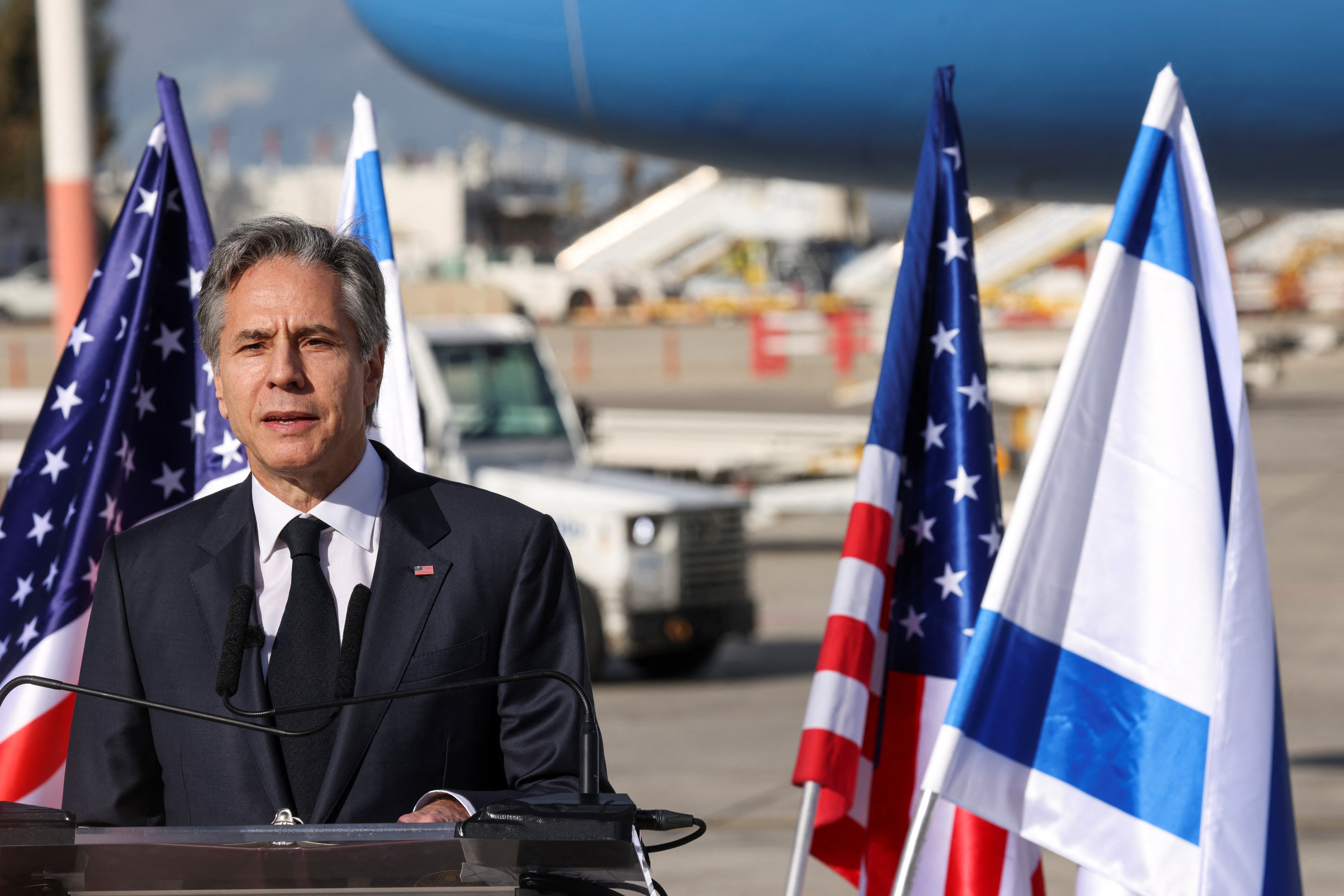 Blinken making statements after landing in Tel Aviv (RONALDO SCHEMIDT/REUTERS)