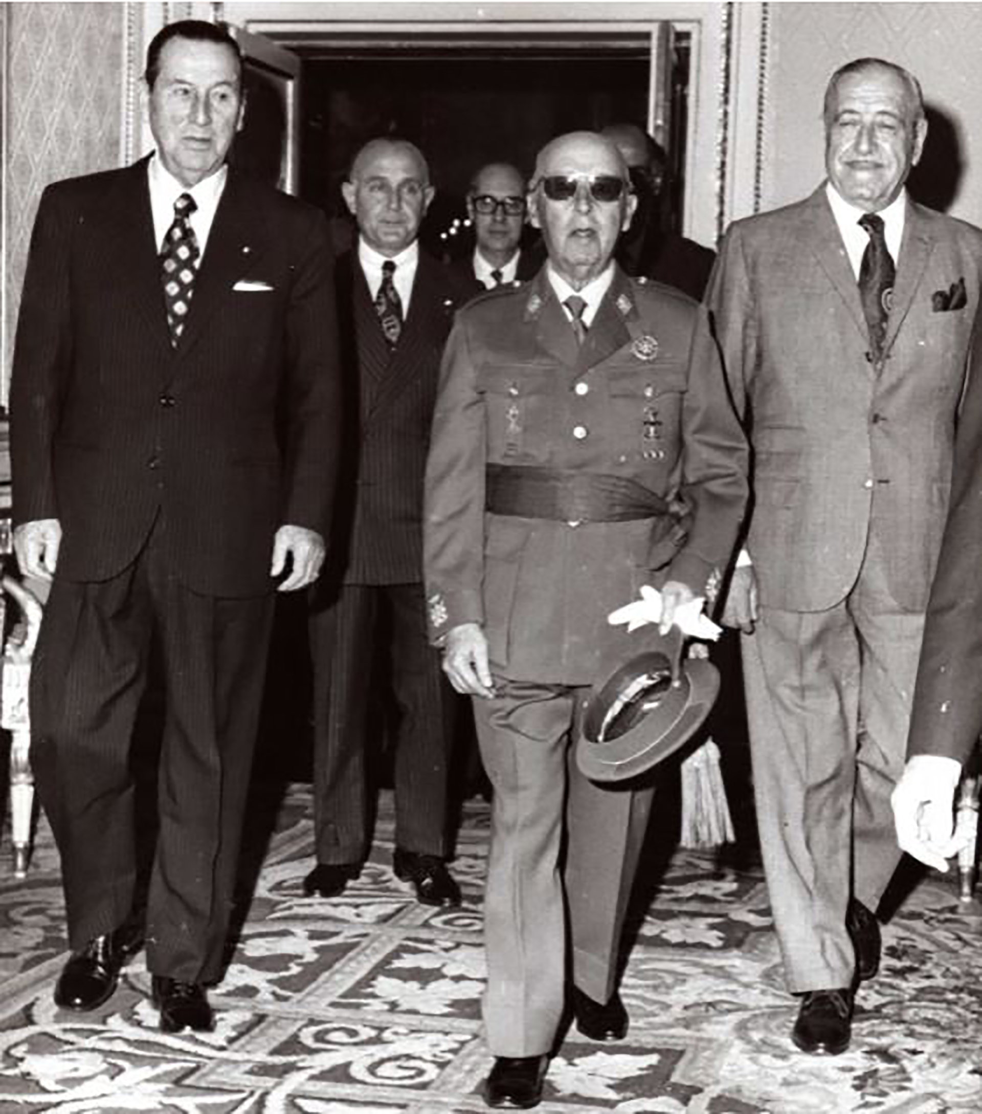 Perón, Franco y Cámpora, seguidos por Benito Llambí y Armando Puente