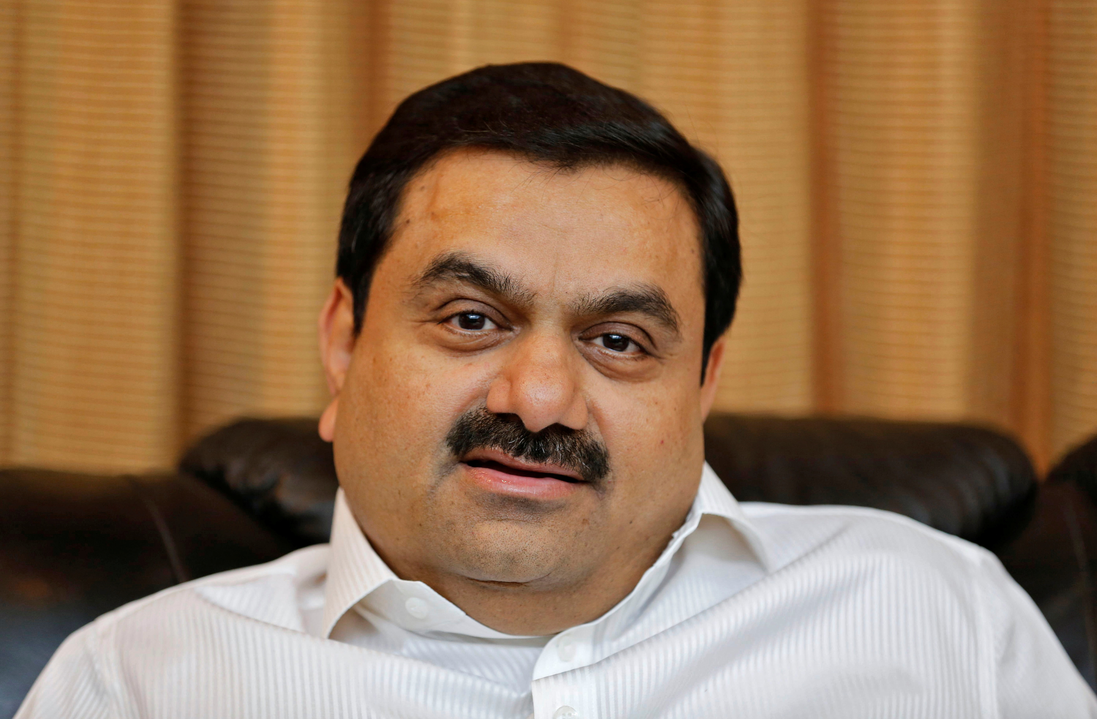 FILE PHOTO: Indian billionaire Gautam Adani speaks during an interview with Reuters at his office in the western Indian city of Ahmedabad April 2, 2014. REUTERS/Amit Dave/File Photo